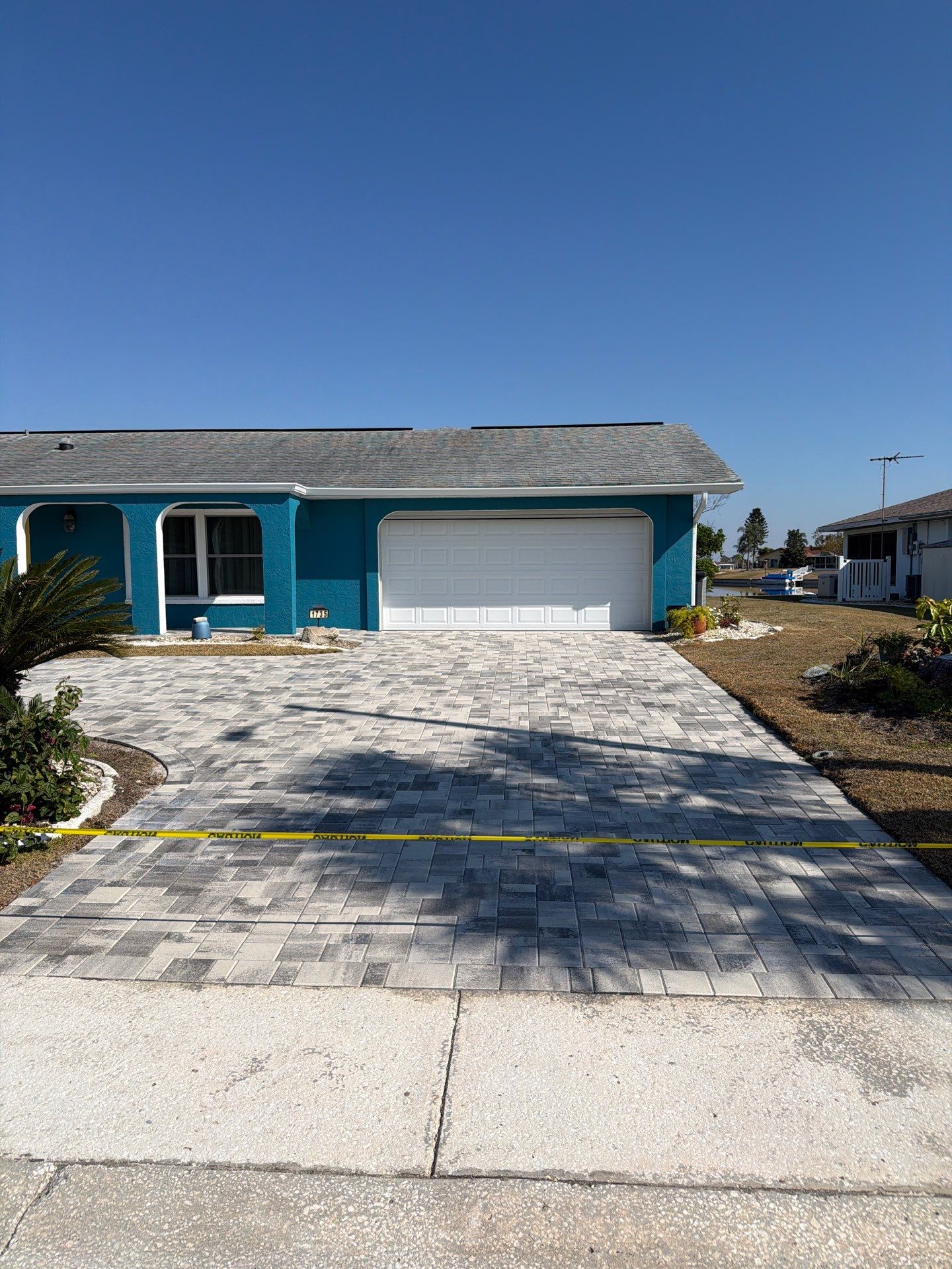 Modern Gray Paver Driveway and Entryway Walkway in Sun City Center by Supreme Paver Experts