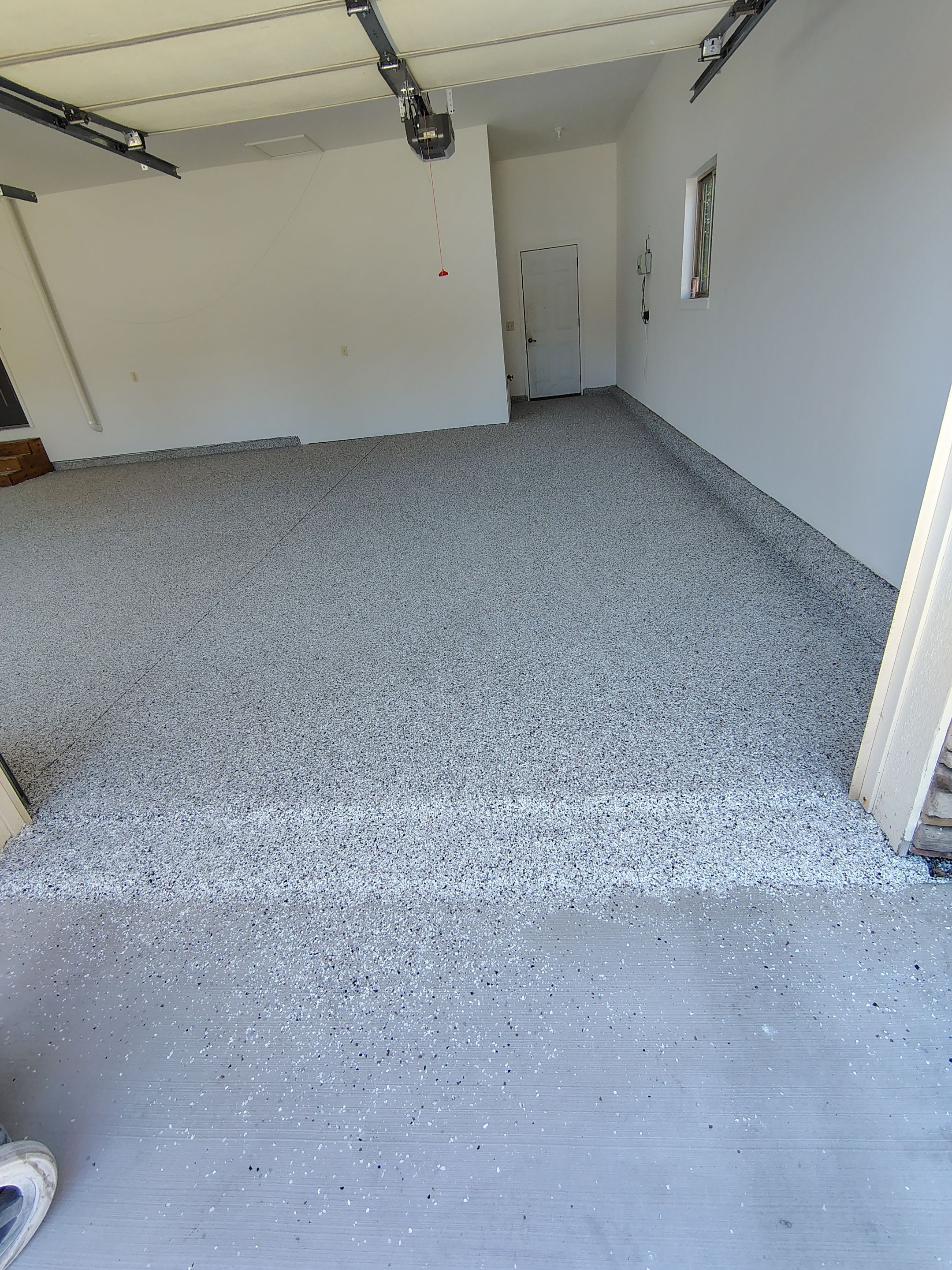 Custom Grey Speckled Epoxy Floor Coating for Sioux Falls Garage by Select Painting, Coatings & Garage Cabinets