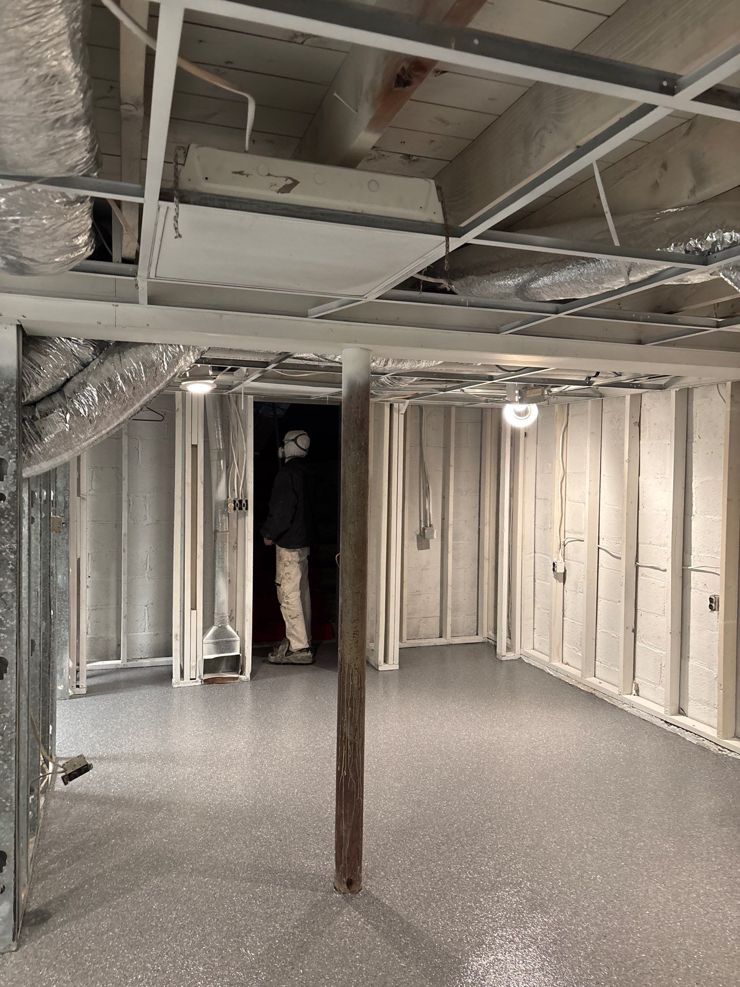 Basement Concrete Floor Coating with Penntek Flake System by Spectrum Painting, LLC