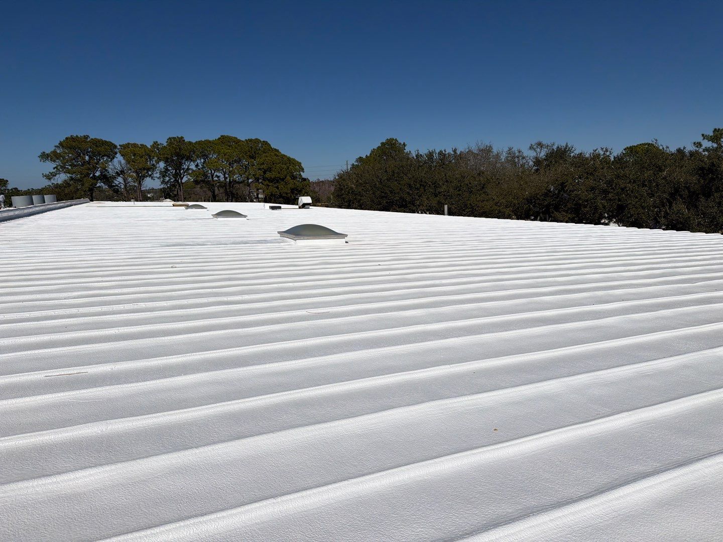 Sarasota Industrial Warehouse Metal Roof Silicone Coating Restoration by CES Roofing