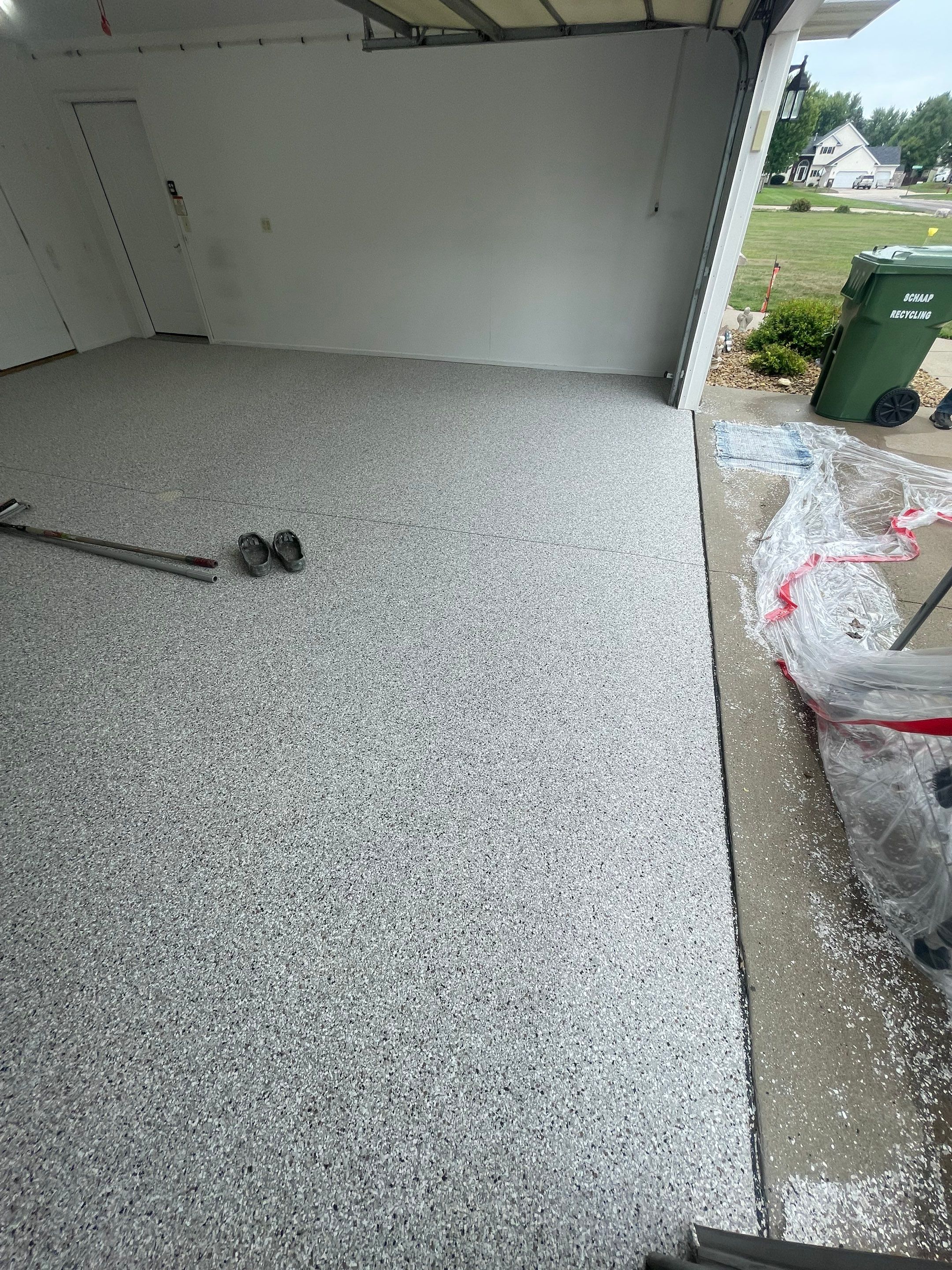 Coyote Flake Garage Floor Coating in Worthington, Minnesota by Select Painting, Coatings & Garage Cabinets