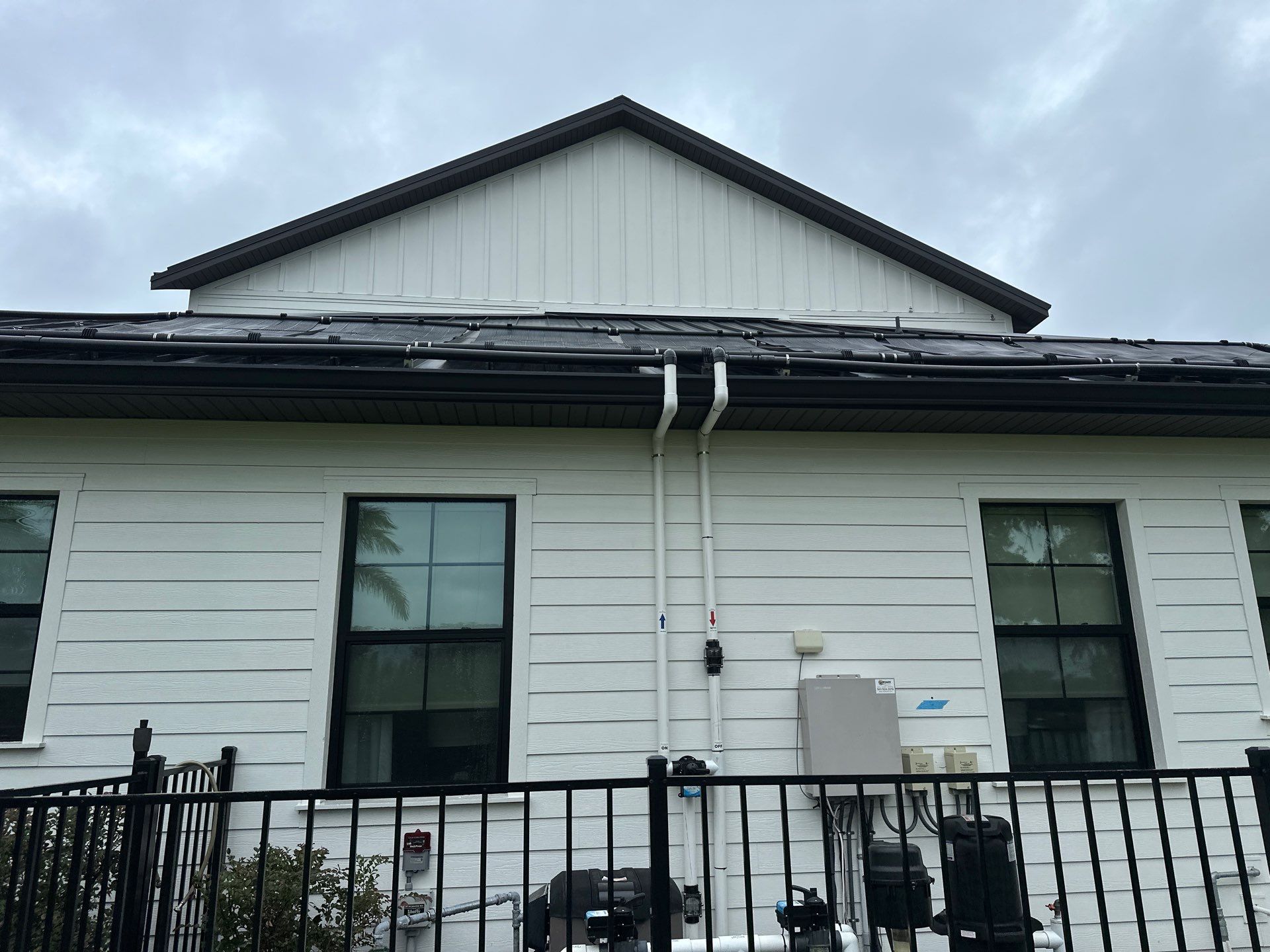 Complete Two-Story House Wash and Driveway Cleaning in Winding River Community, Bradenton, FL by Sunshine AquaWash