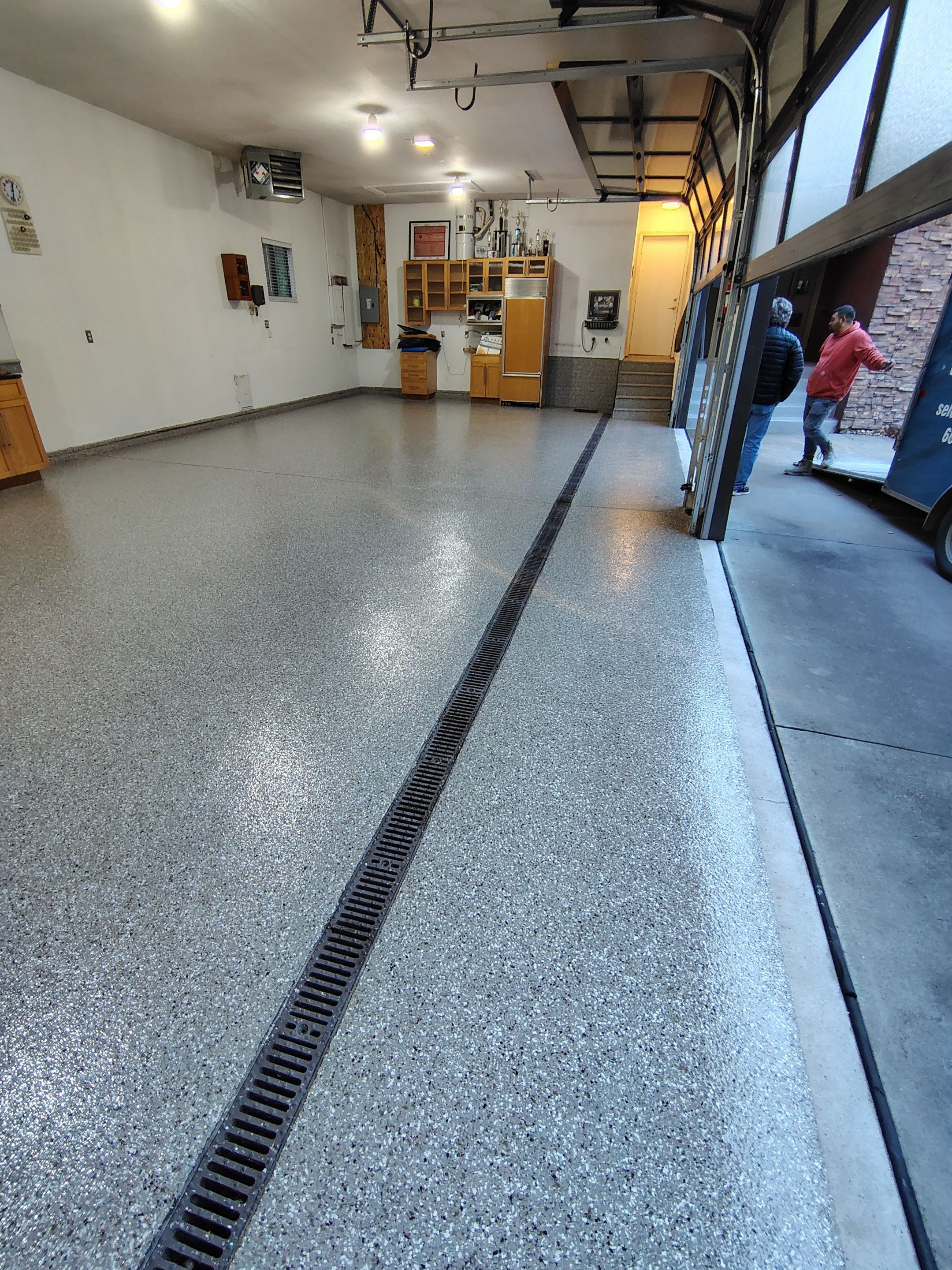 Garage Floor and Entry Step Concrete Coating in Sioux Falls by Select Painting, Coatings & Garage Cabinets