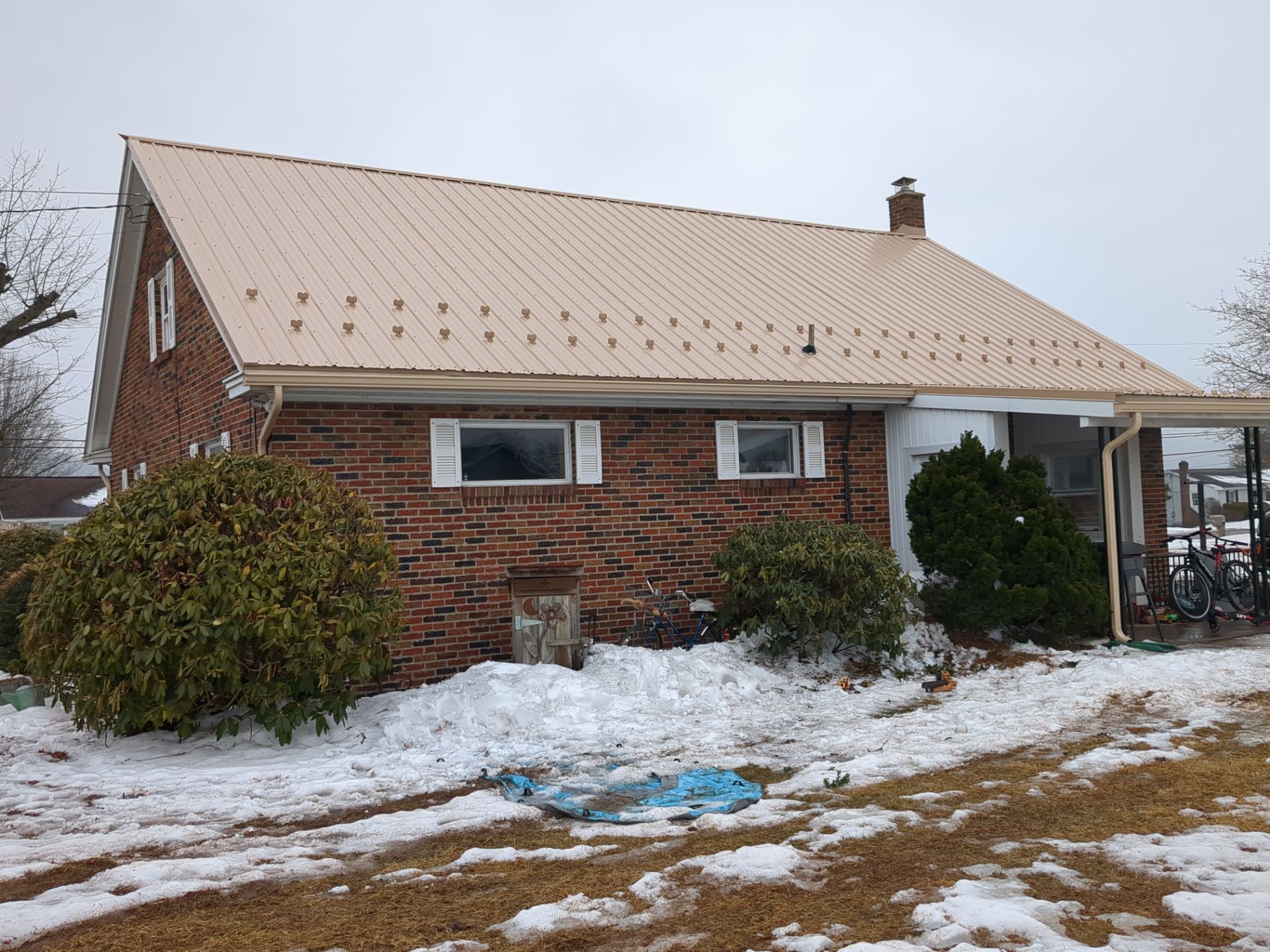 Tan Metal Roof and Gutter Replacement for Valley View Home by Esh Builders