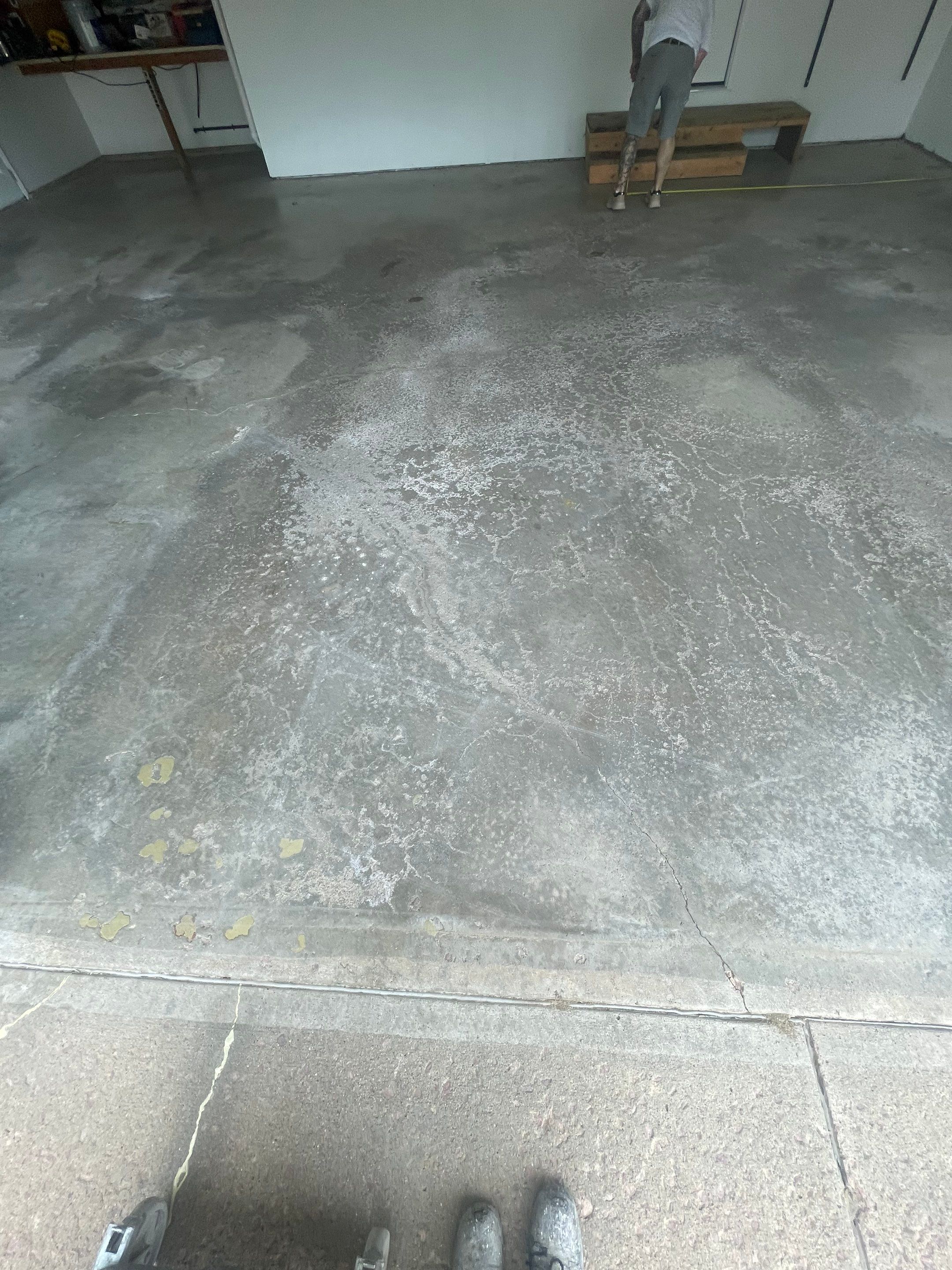 Feather Grey Garage Floor Coating Installation in Sioux Falls by Select Painting, Coatings & Garage Cabinets