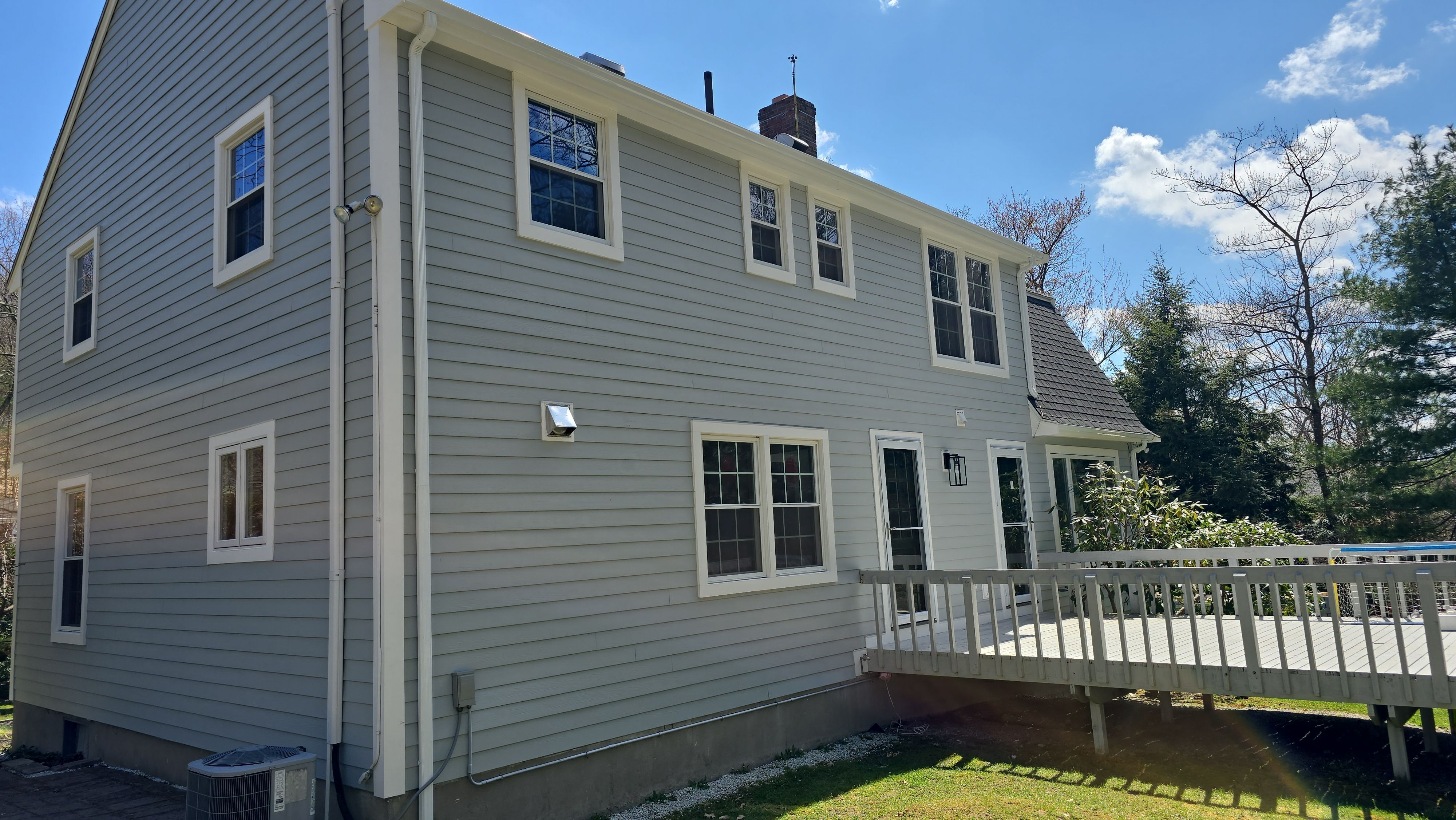 Custom window trim work and siding replacement in Dover, MA by UBrothers Construction