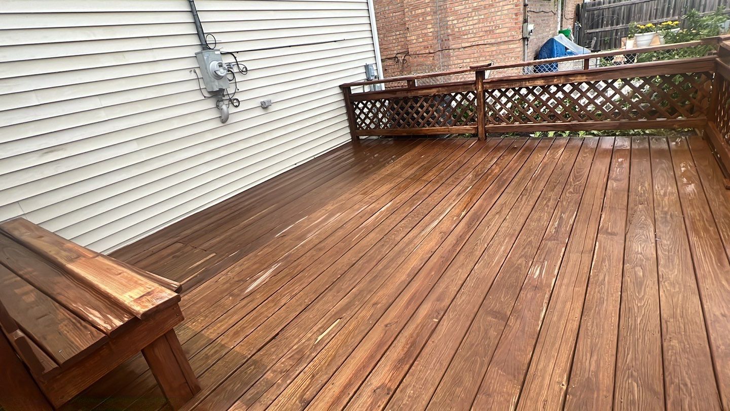 Wood cleaning and staining using Armstrong cloark oil stain by Northern Power Washing LLC.