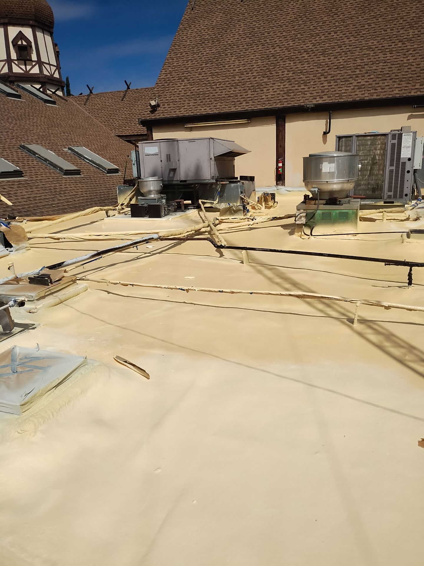 Spray foam and coatings using General Coatings acrylic coatings and spray foam by Straight Edge Roofing Inc