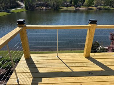 Cumming, GA Lake House Deck Resurface and Extension using Pressure Treated Pine and Skyline Cable Railing