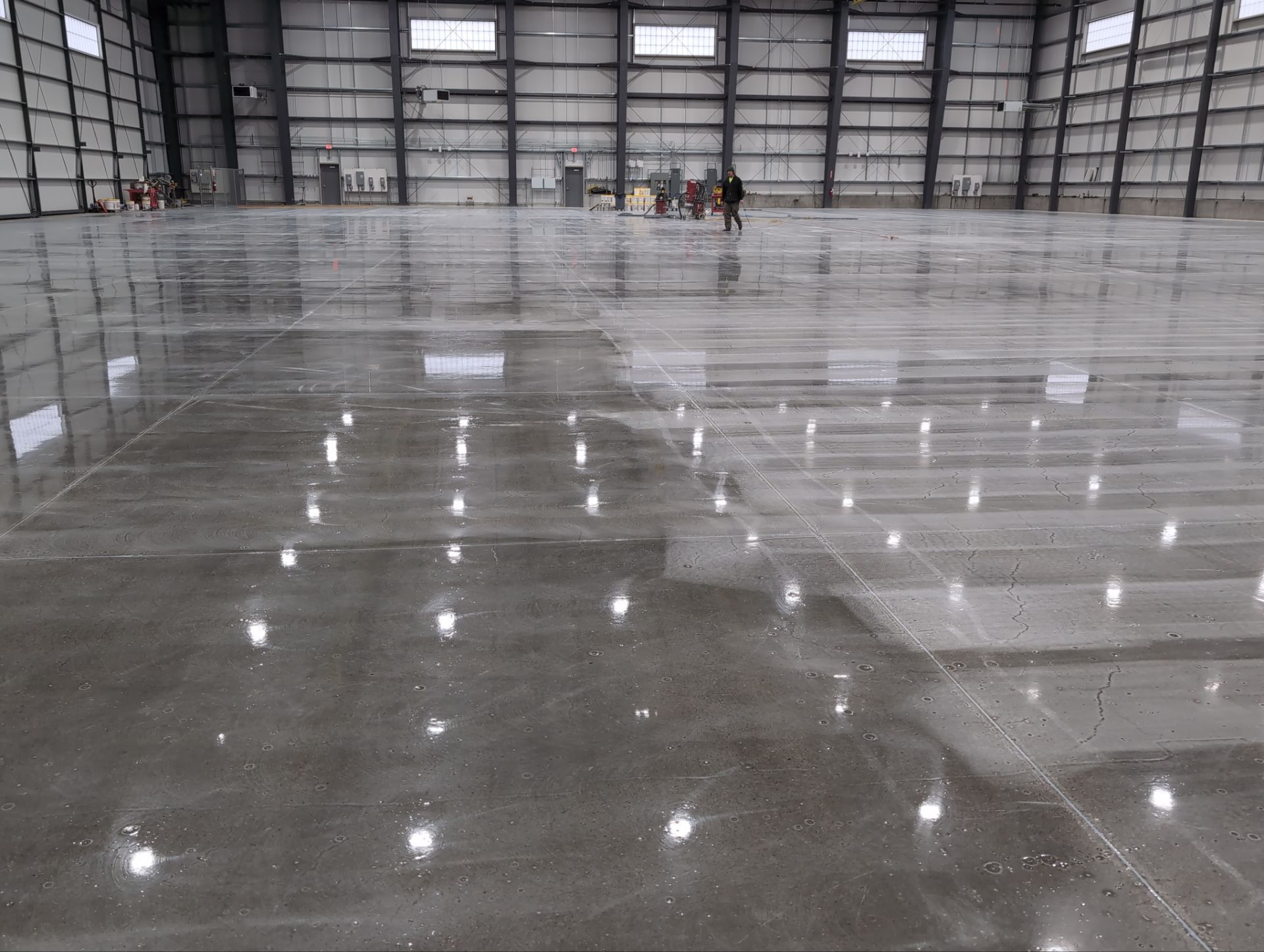 Airplane Hanger using Light Grey Commercial Penntek Epoxy by Croc Coatings, LLC