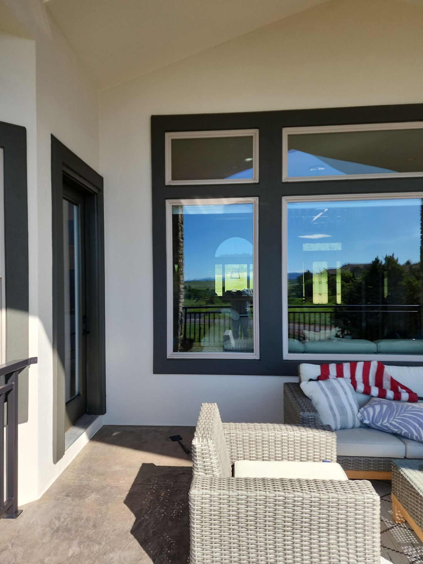 Castle Rock Elegance: White Stucco Exterior with Bold Tricorn Black by J&M Painting LLC