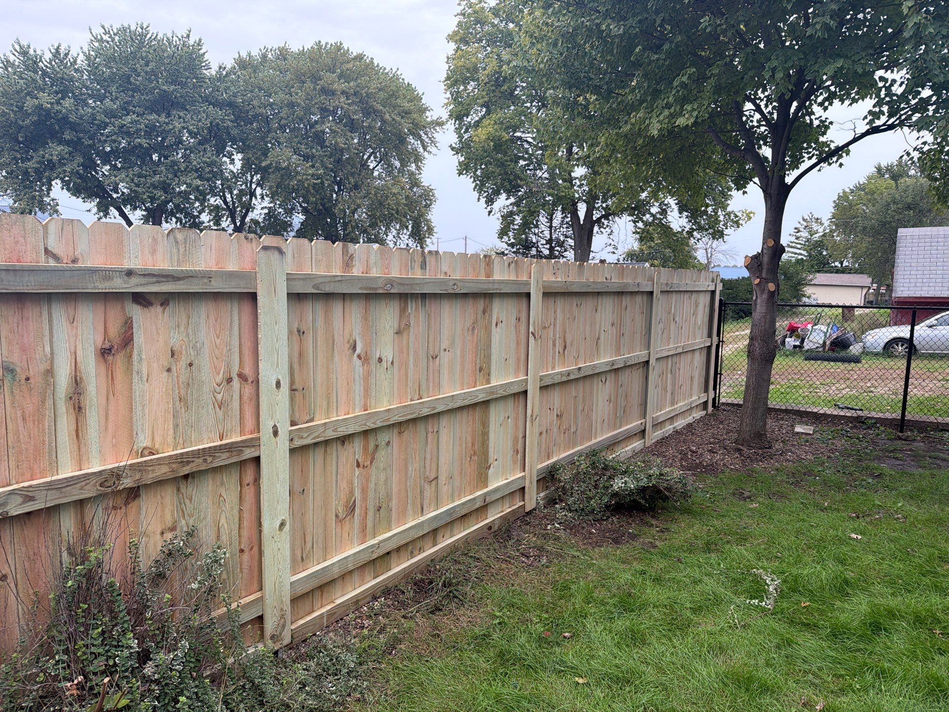 Custom Wood Privacy and Black Chain Link Fence in Hudson by Perfect Picket Fence and Stain