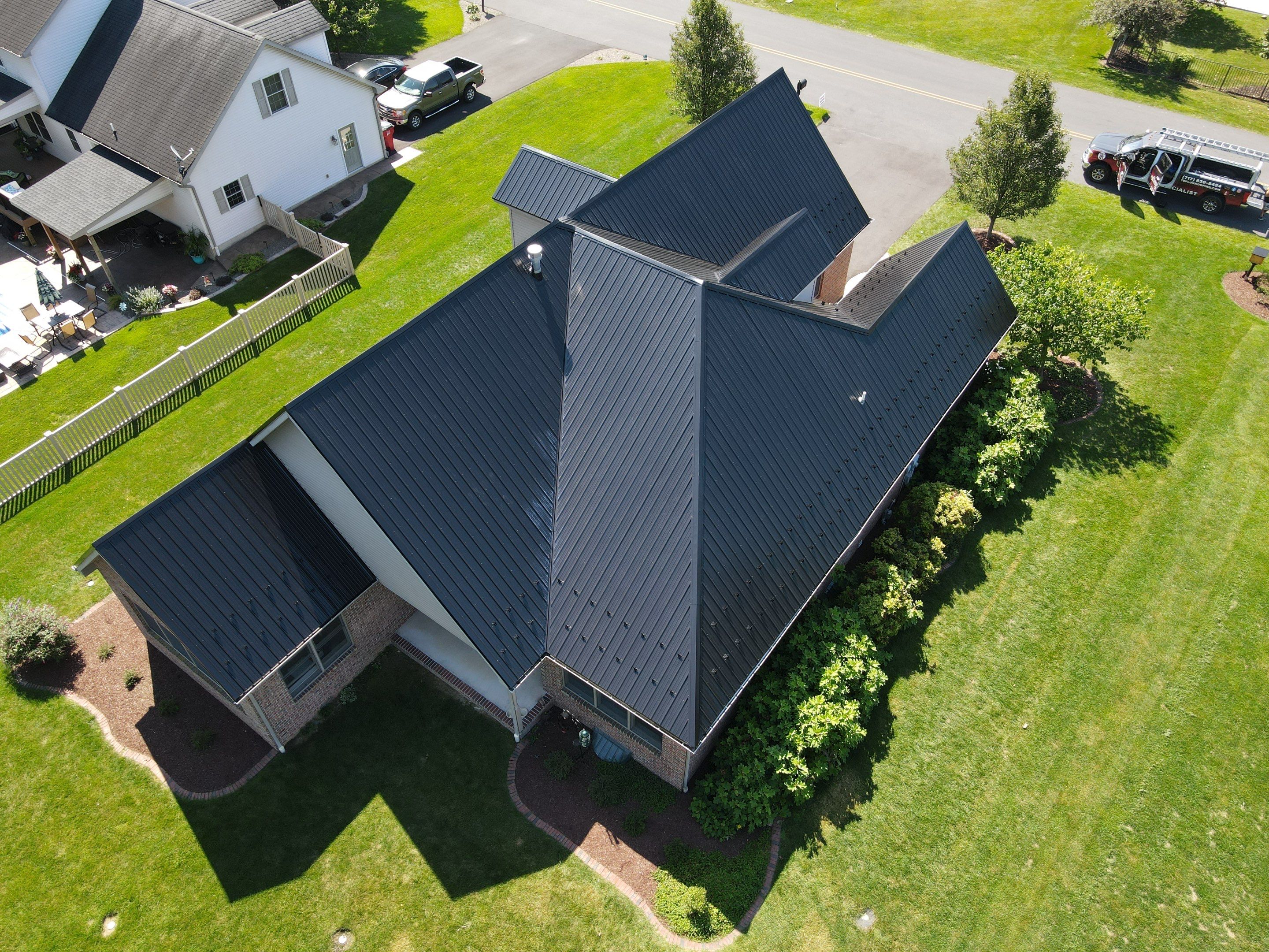 Standing seam / Azm panel in black  by Teflon Roofing