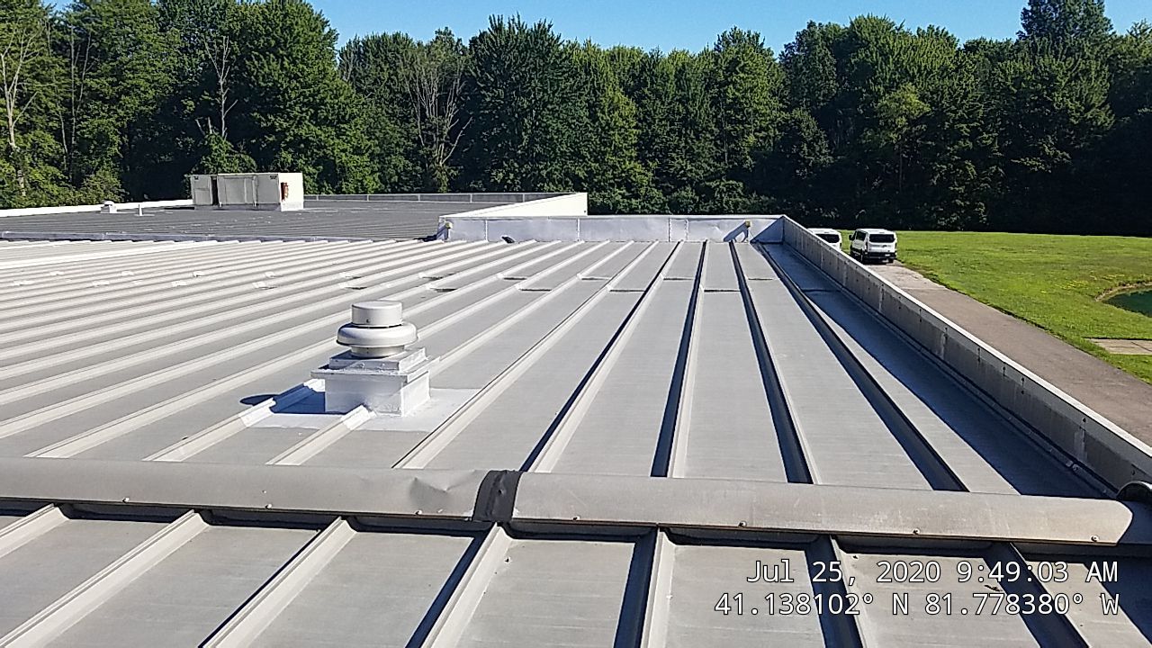 Commercial Metal Roof Coating by Gold Star Roofing LLC