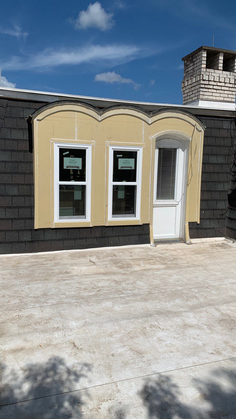 Mansard Charm by Bayfront Roofing and Construction