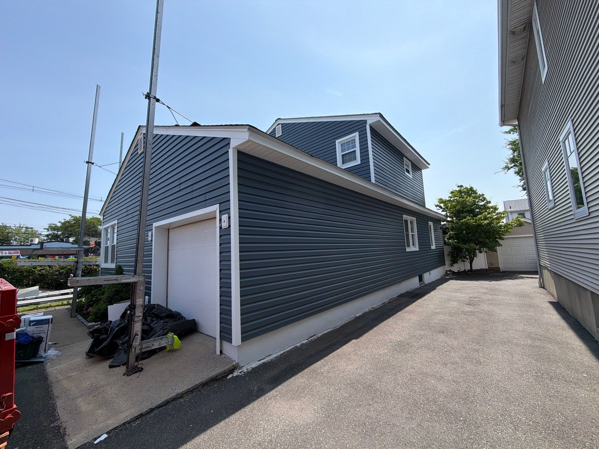 Full Exterior Renovation Featuring GAF Shingles and Siding in Kearny by REVIXPRO 
