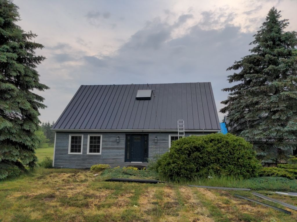 Residential Roofing Installation using 24 Ga Standing Seam Metal  by Jay Carter Roofing & Sheet Metal