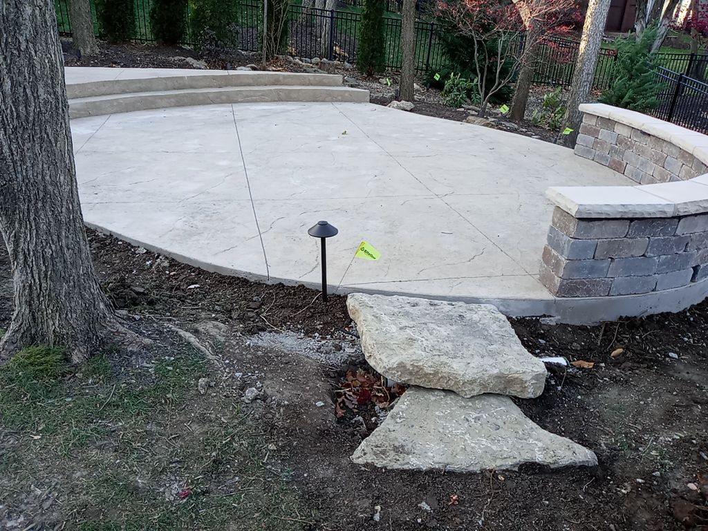Back Yard Alpine Stamped Patio by LAND ESCAPES LLC