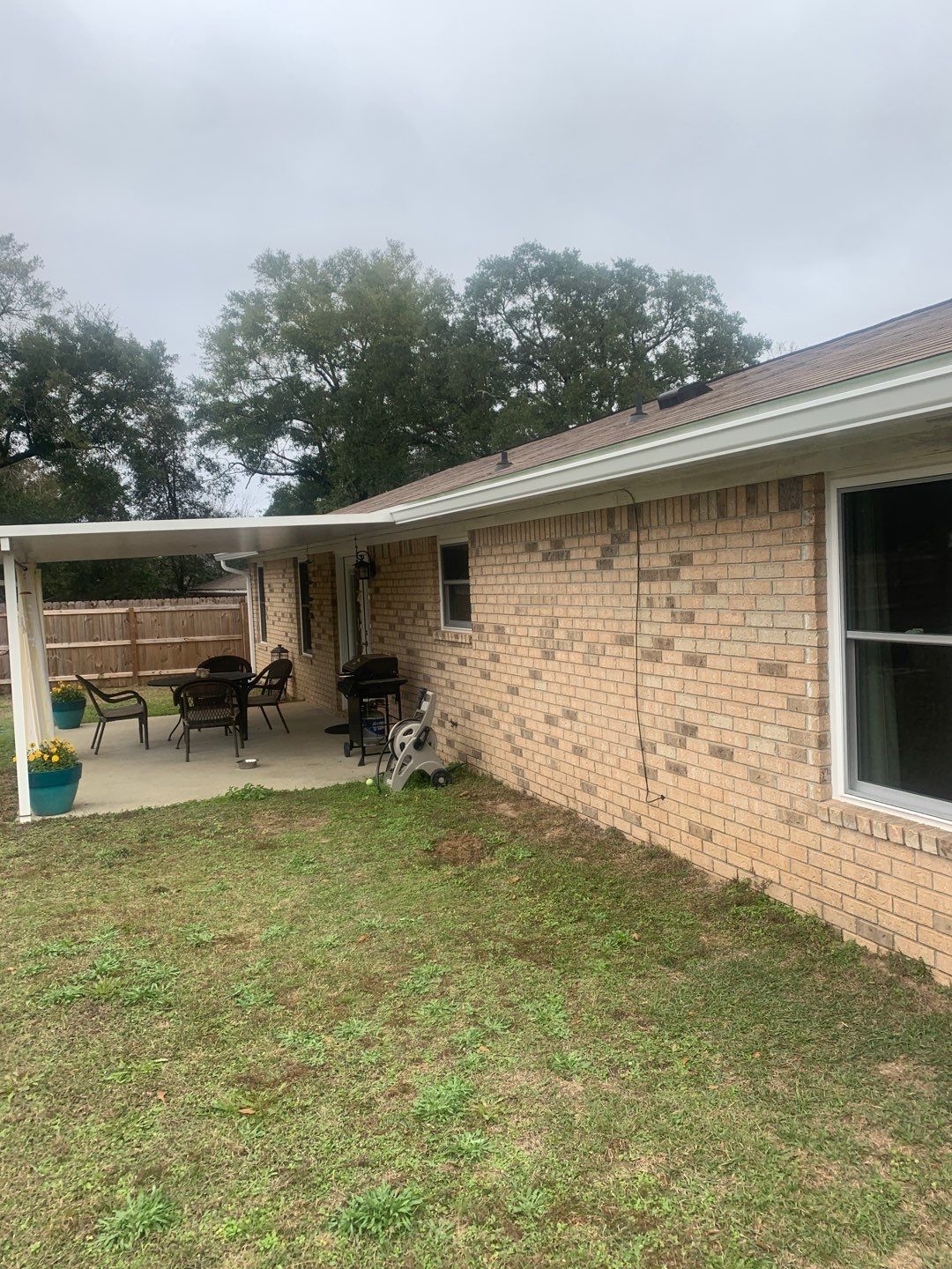 White Seamless Gutter Installation in Milton FL by Gutter Professors