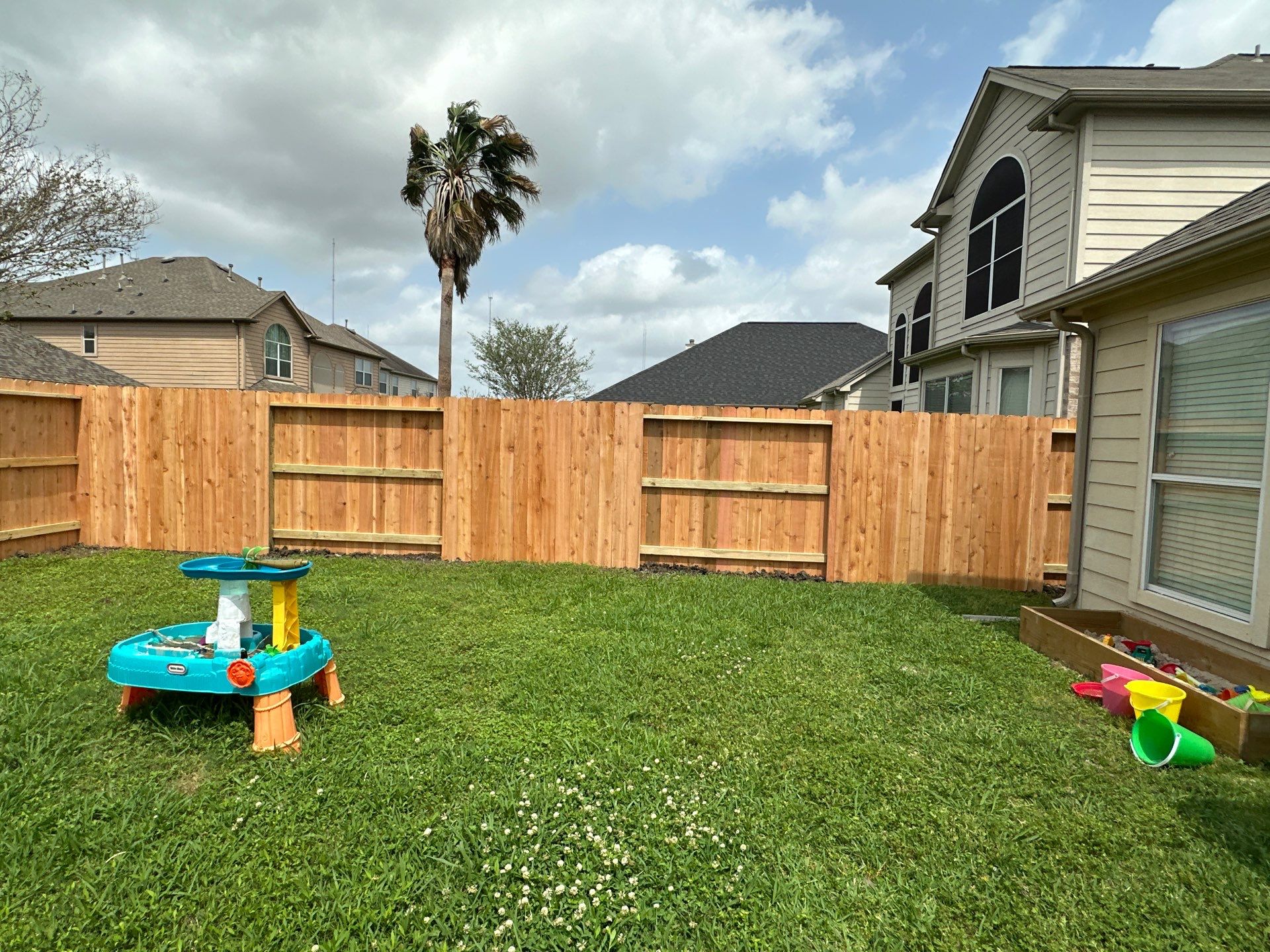 Wood fence with alternating panels by Tim's Fences