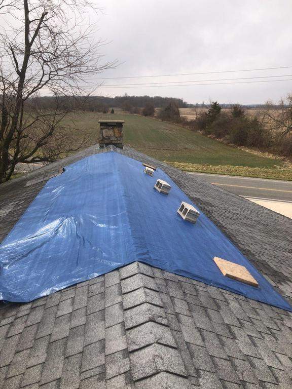 Storm damage roof replacement by Nitro Roofing and Construction