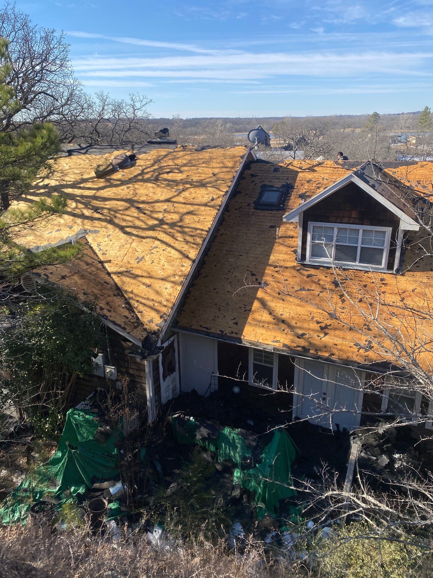 Roof Replacement on a private lake near Ardmore by BANA Roofing and Solar Supply