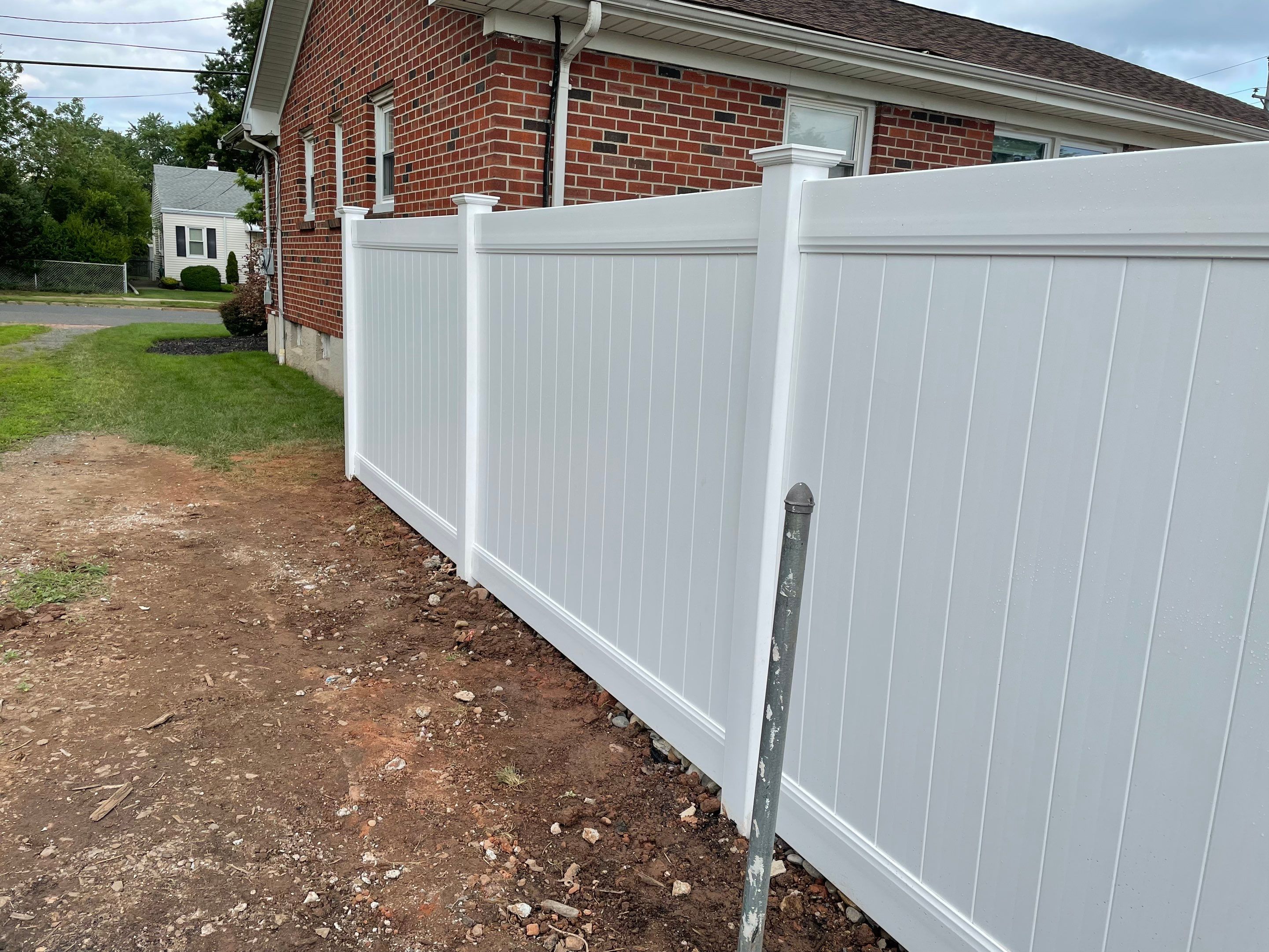 Fence Installation using White Fence by Home Concepts Construction