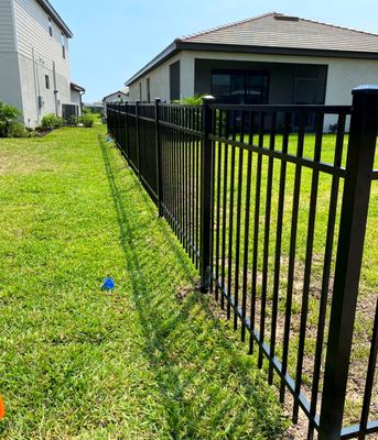 Aluminum Fence Installation using Black 3 Rail Aluminum Fence