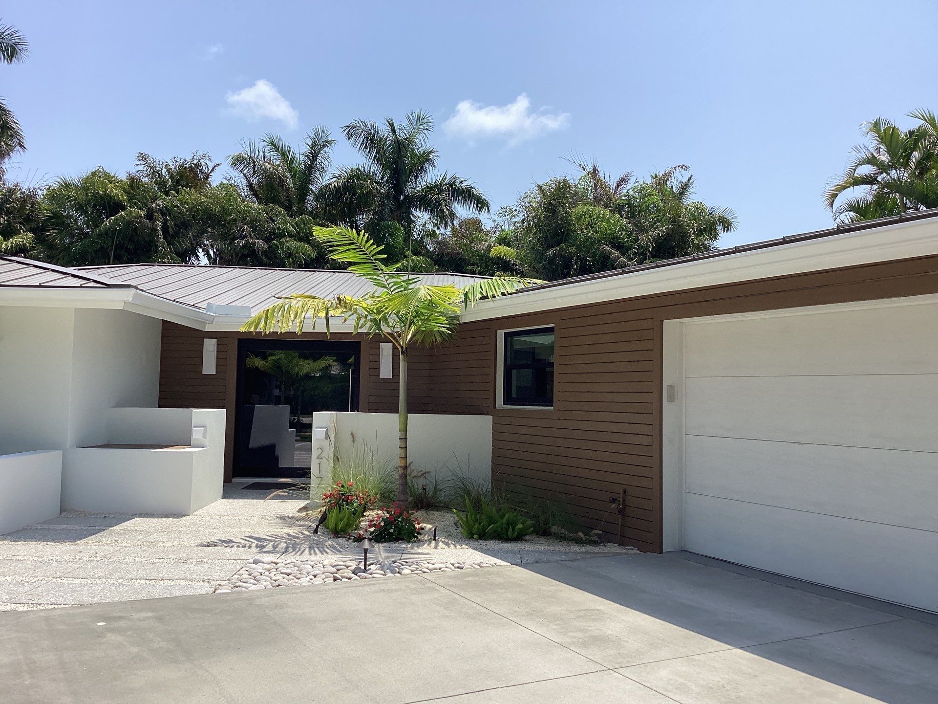 White Seamless Gutters and Downspouts in Sarasota FL by Gutter Professors