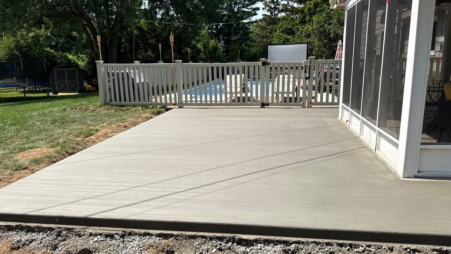 Broom finished concrete patio and sidewalk  by NG Masonry & Construction LLC