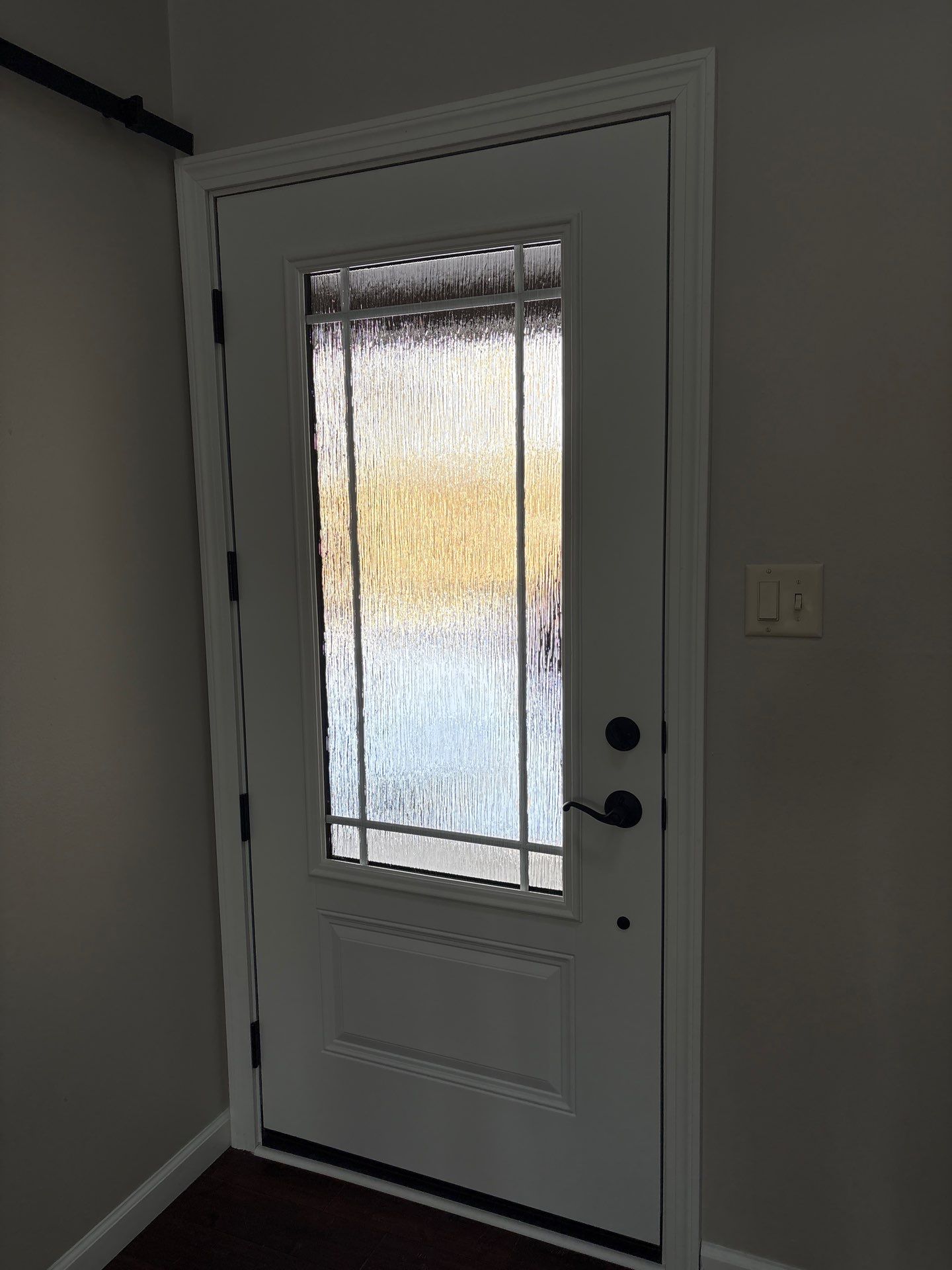 Modern Black Front Door Installation in Greenwood by Merrifield Exteriors, LLC