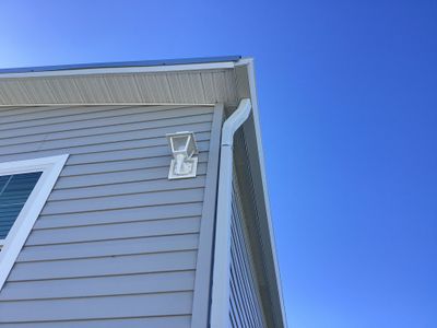 White Downspouts Installation in St. James City