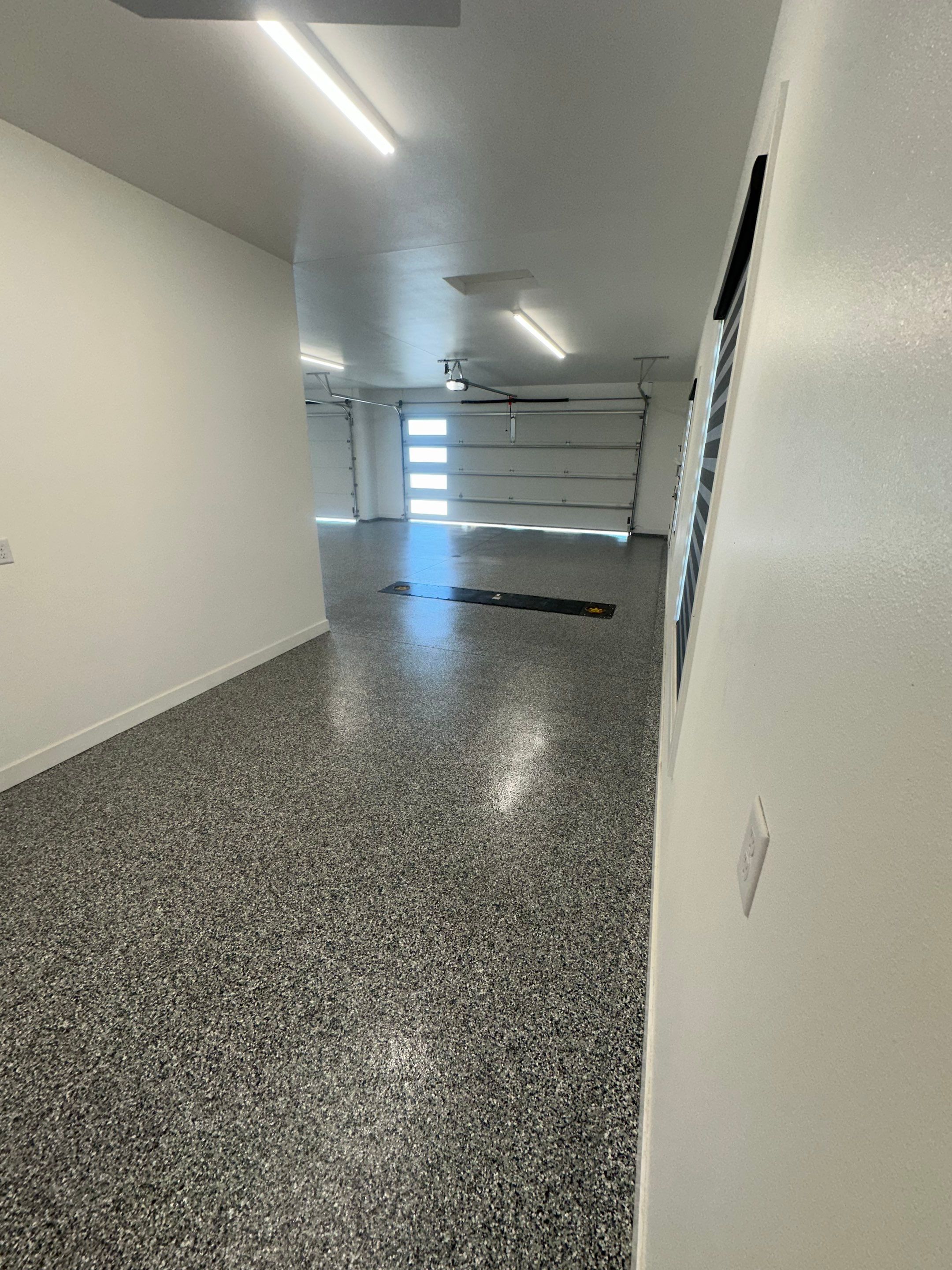 Multi-Color Epoxy Flake Garage Floor Installation in Sioux Falls by Select Painting, Coatings & Garage Cabinets