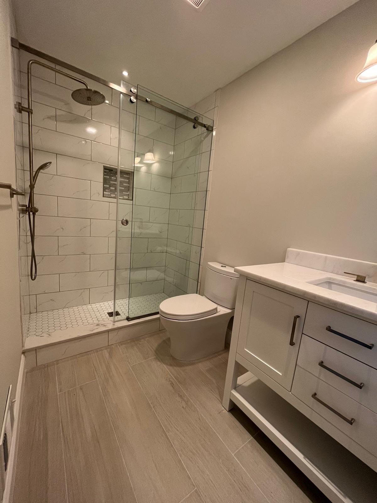 Bathroom Remodel using Tile by Home Concepts Construction