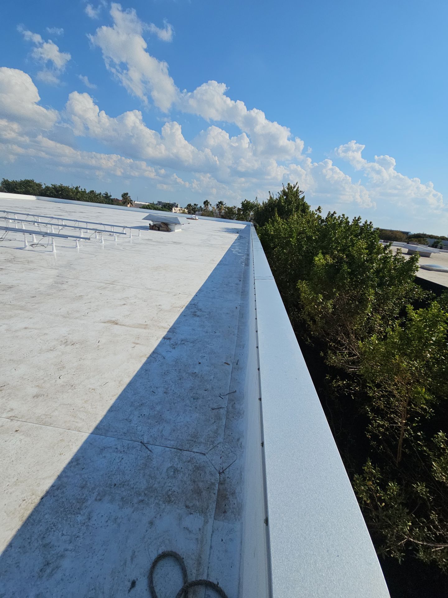 White TPO Membrane Roof Replacement at Doral Commercial Building by AJF ROOFING INC