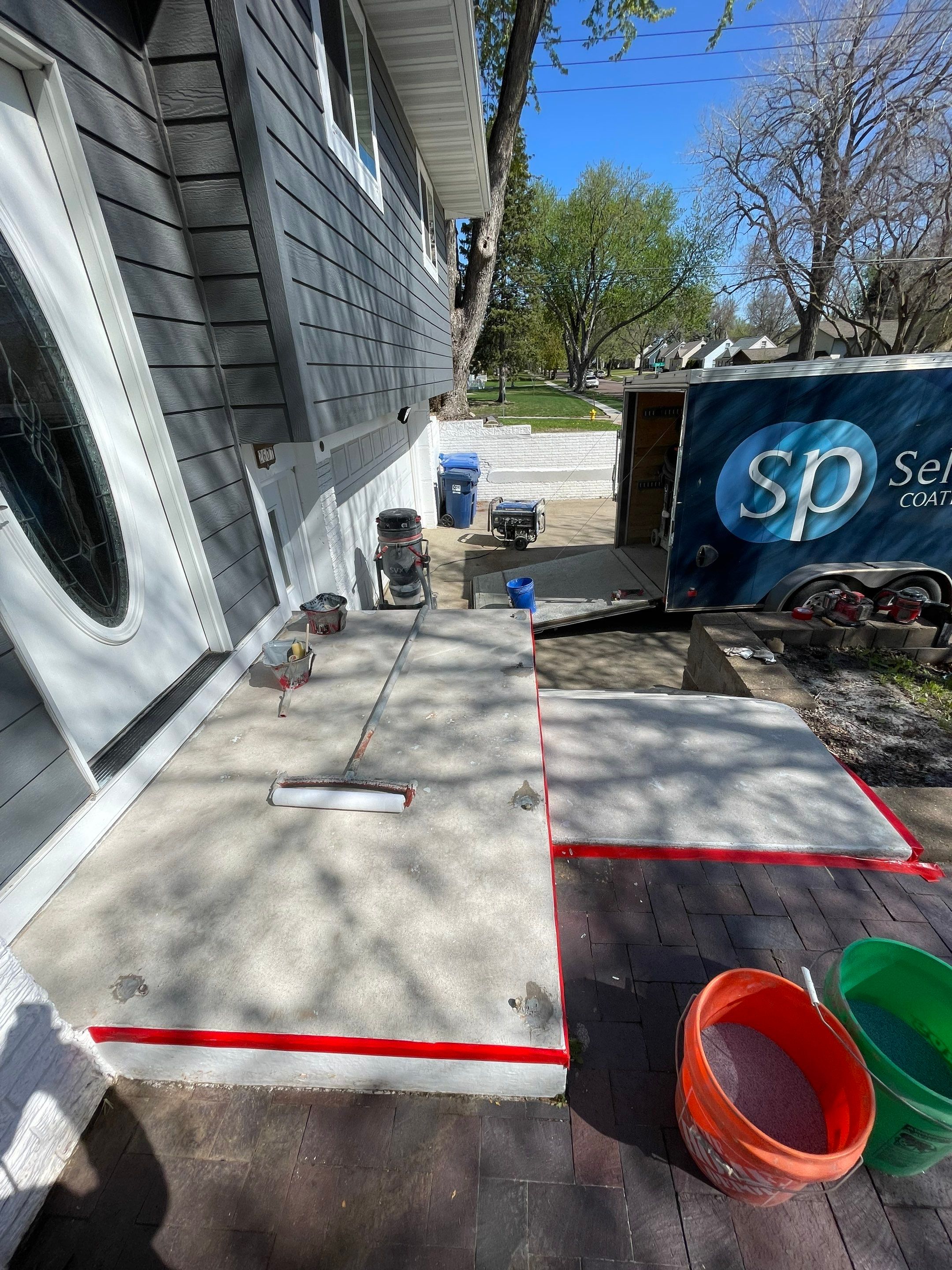 Grey Polyaspartic Porch and Stair Resurfacing in Sioux Falls by Select Painting, Coatings & Garage Cabinets