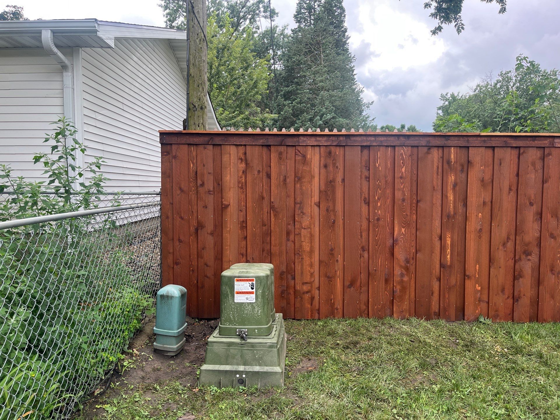 Board on Board Wood Privacy Fence Installation in Cedar Falls by Perfect Picket Fence and Stain