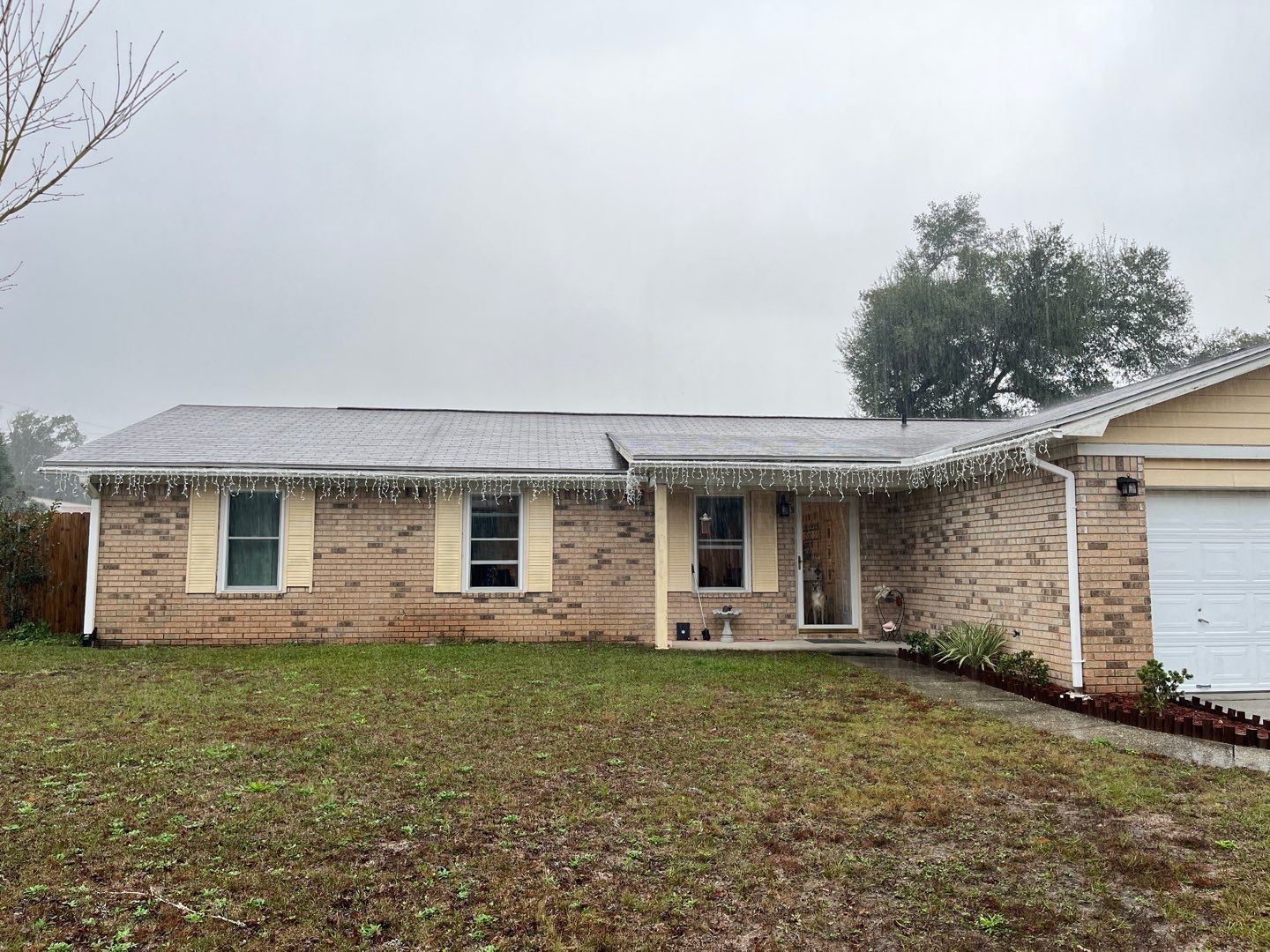 White Seamless Gutter Installation in Milton FL by Gutter Professors