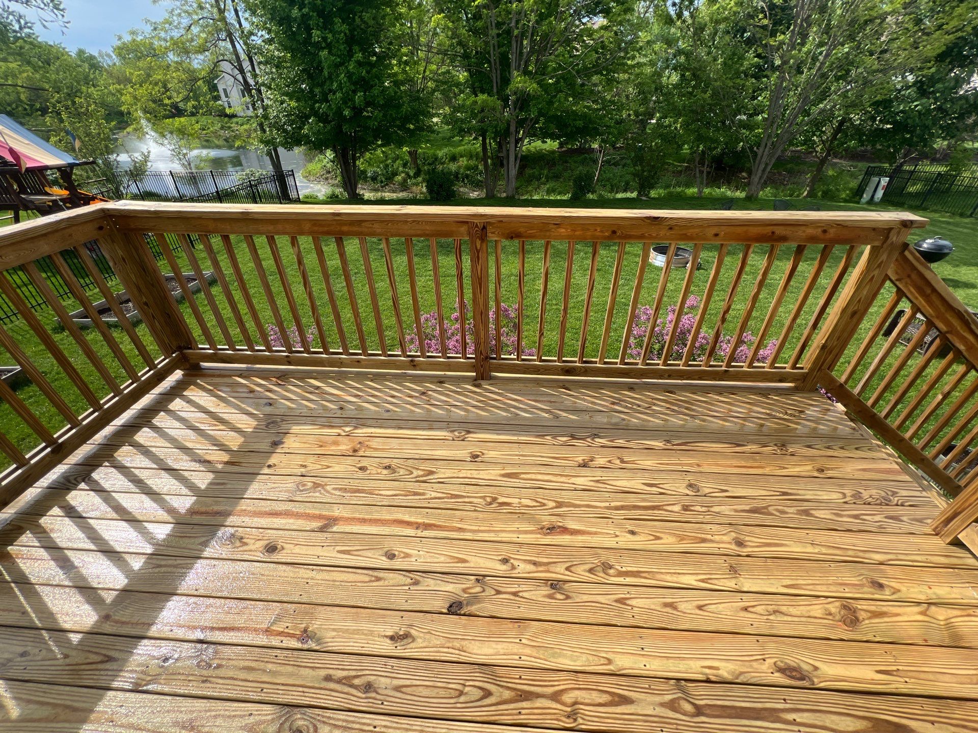 wood deck cleaning and staining by Northern Power Washing LLC.