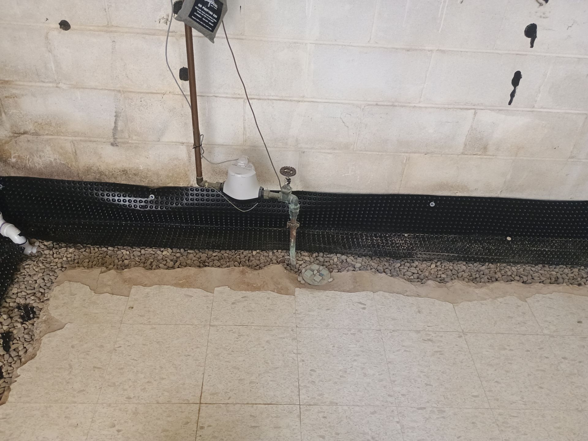 Interior Drain Tile Installation in Columbia Heights, MN by Waterproofing Northeast