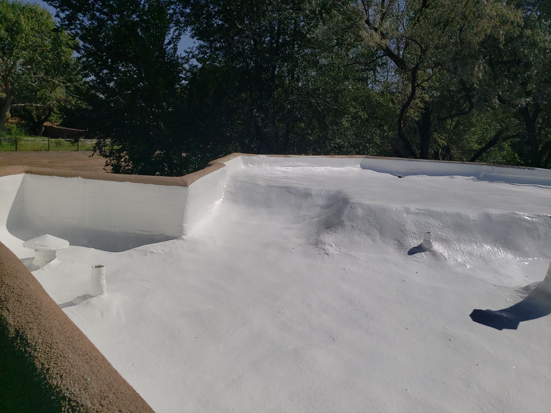 Residential roof application by SPF Services 