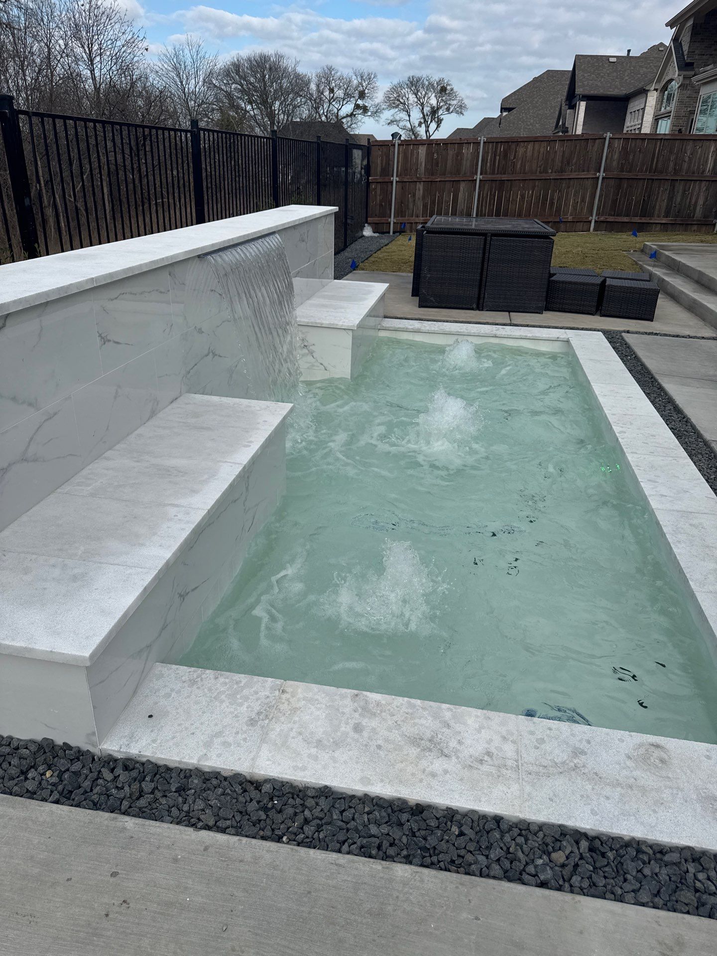 Sleek Modern Pool with Raised Back Wall by Pinnacle Pools and Spas - DFW