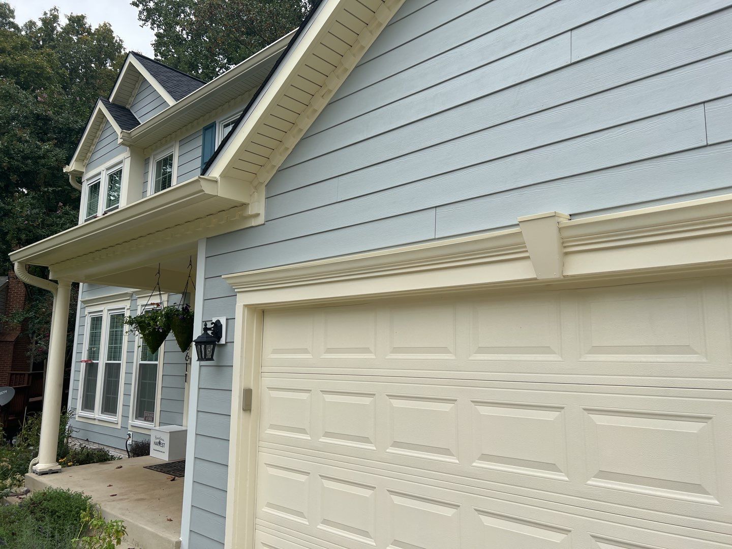 Exterior Home Makeover using GAF Timberline HDZ, GAF Decotech, and James Hardie Siding by American Home Contractors
