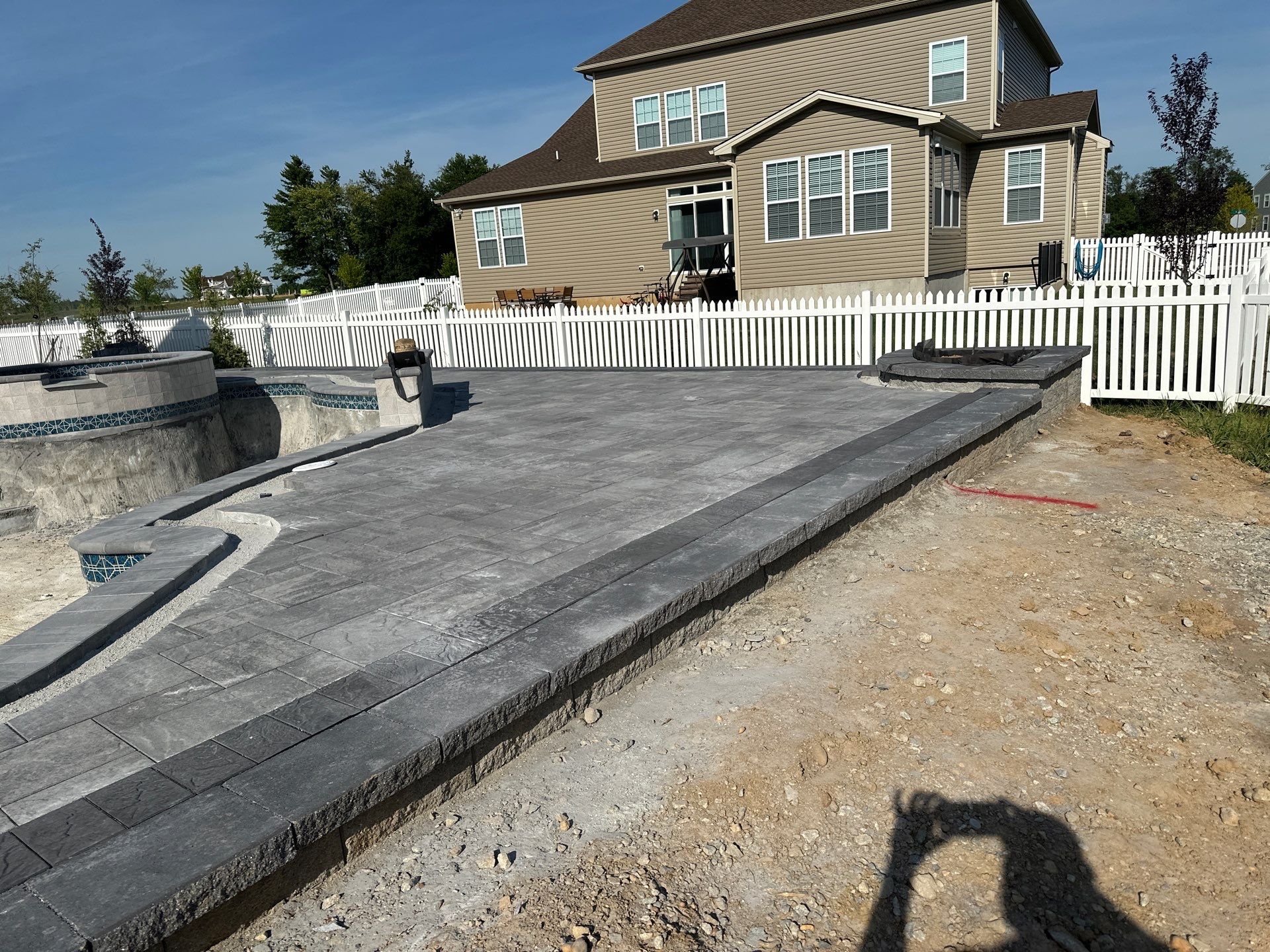 Pool and Hardscape Design in Delaware | Belgard Paver Patio & Outdoor Living Space by Studio G Indoor Spaces & Outdoor Living