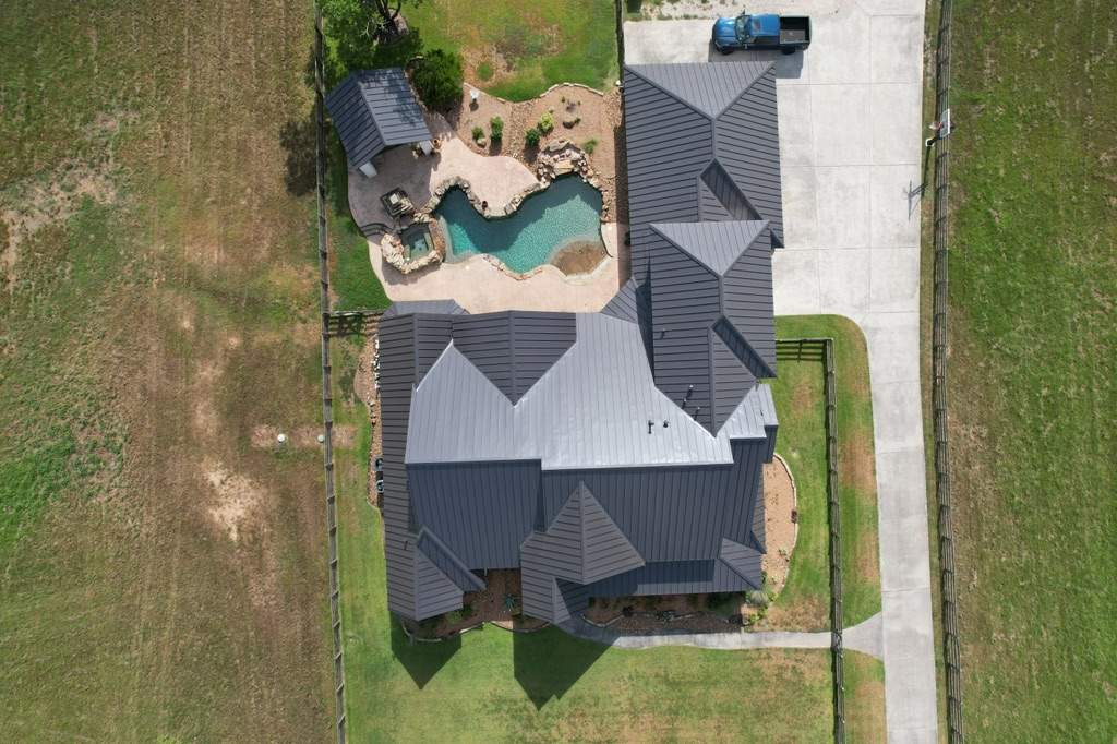 Residential Roofing Installation using Stamding Seam Metal by STX Roofing