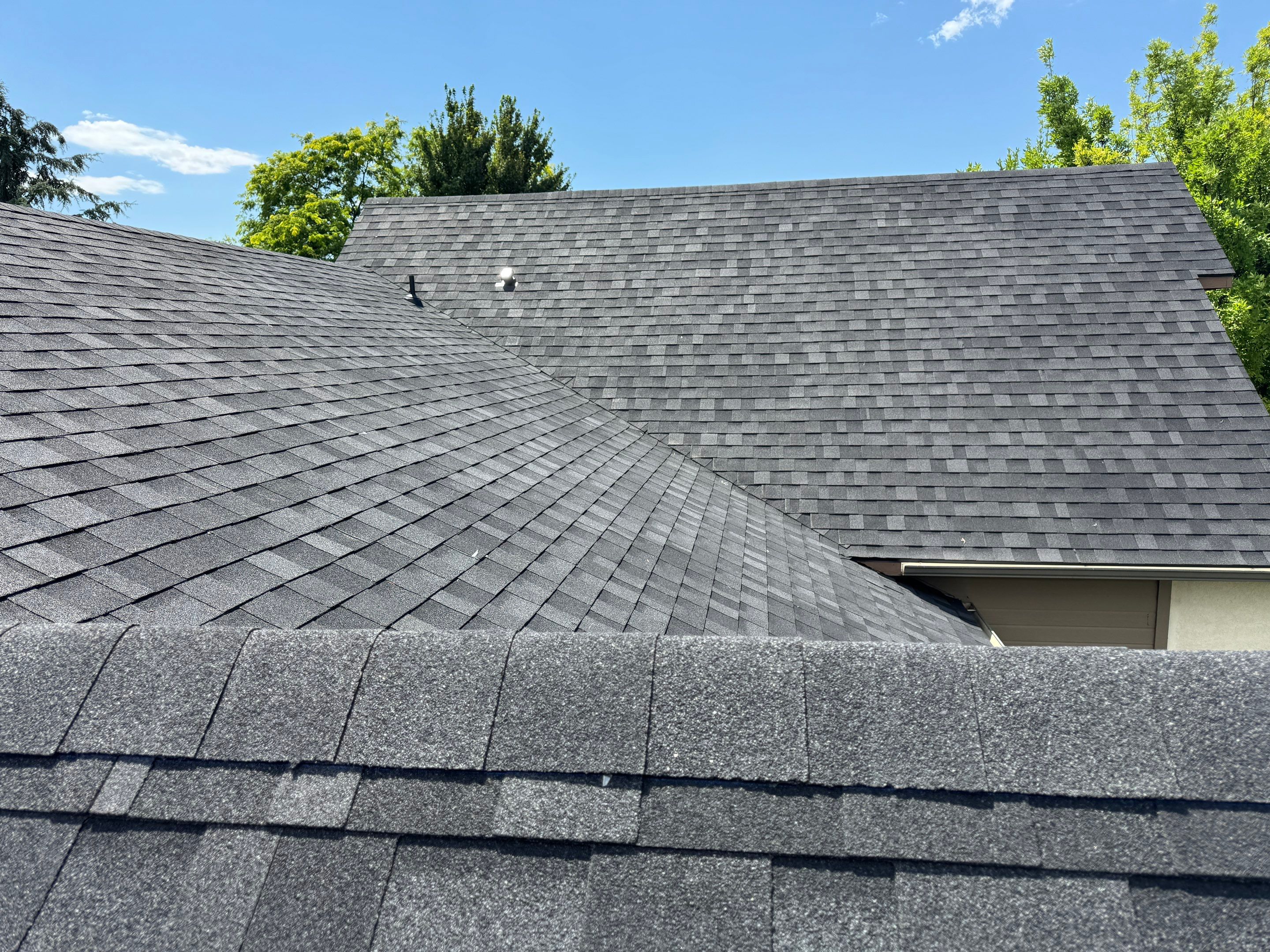 Residential Roof Replacement Featuring Charcoal Grey Architectural Shingles by Olive Roofing
