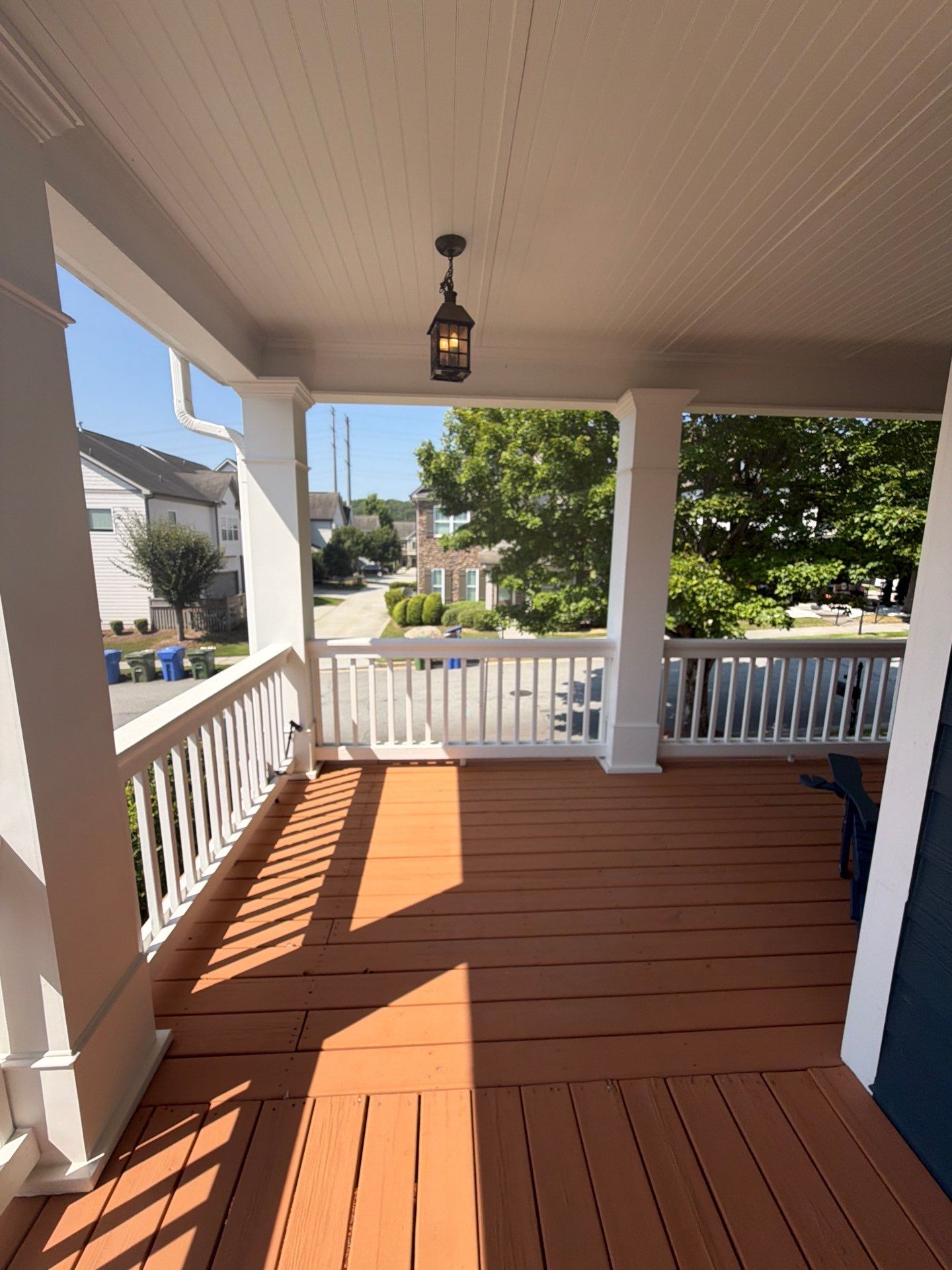 Atlanta Exterior Home Refresh with Blue Siding and Deck Staining by Swift Home Renovations 