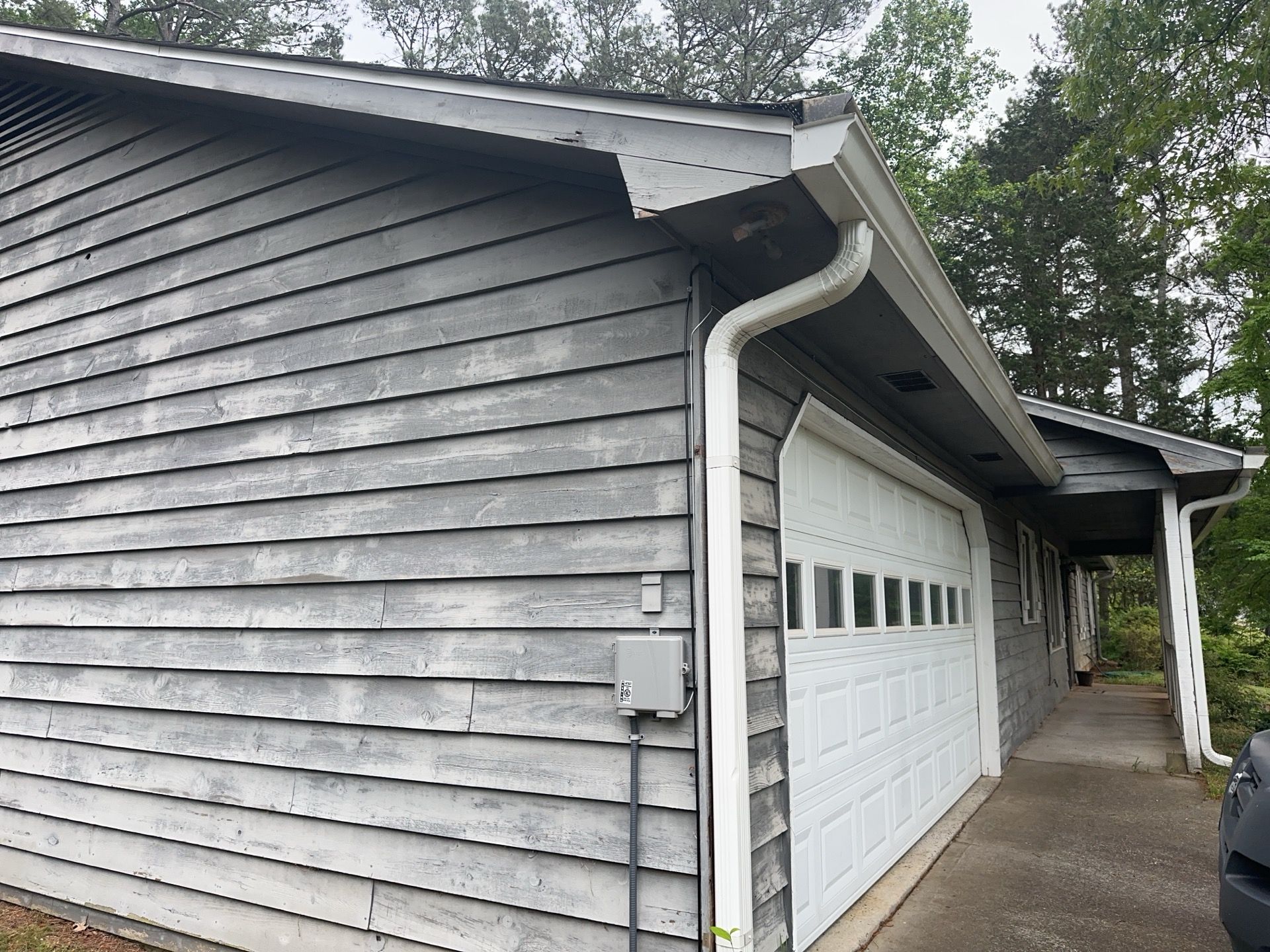 Marietta, GA Exterior Painting Transformation with Blue Paint by Nelson Exteriors