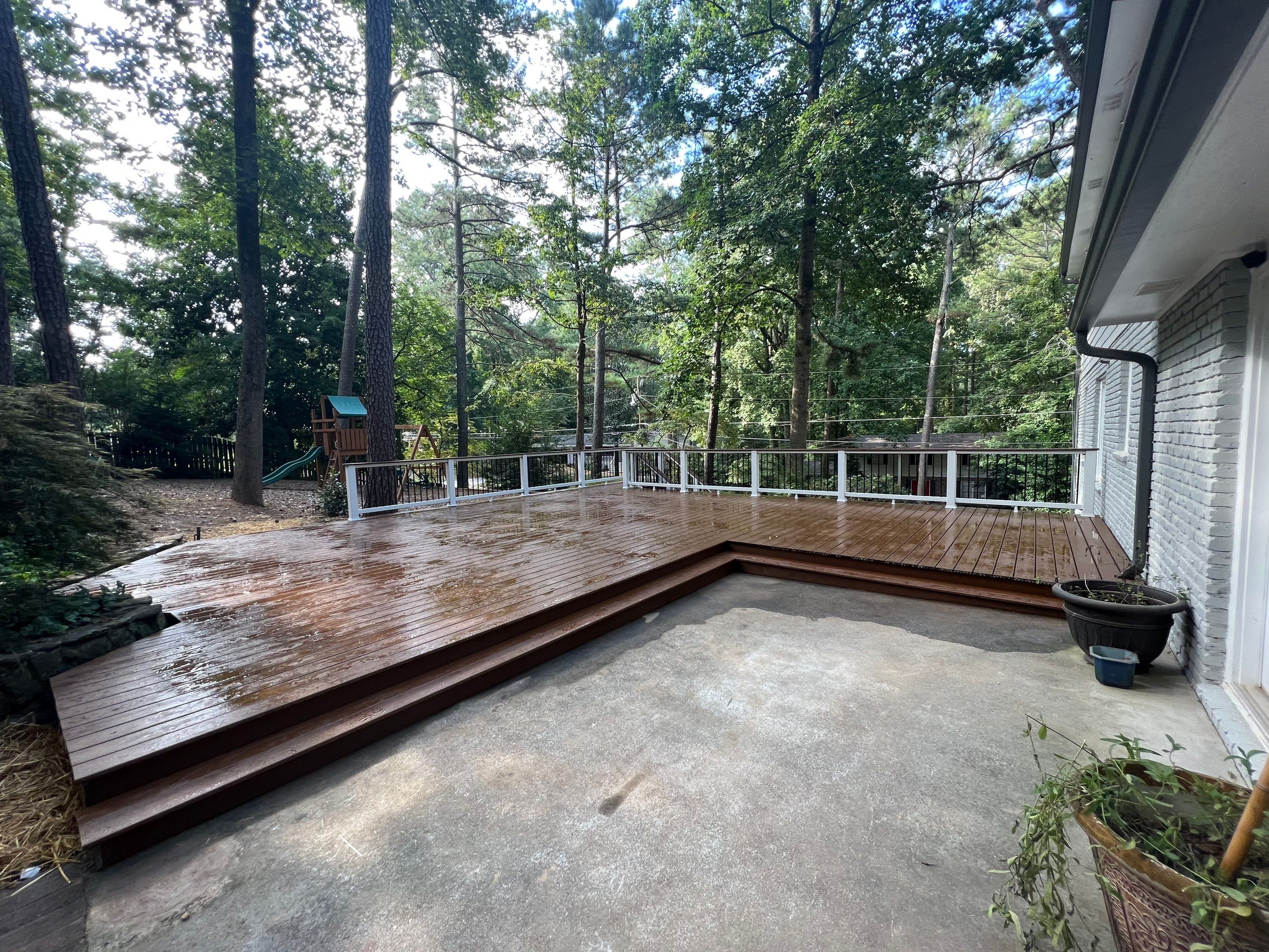 Custom Stained Wood Deck Installation with White Railings in Atlanta by Swift Home Renovations