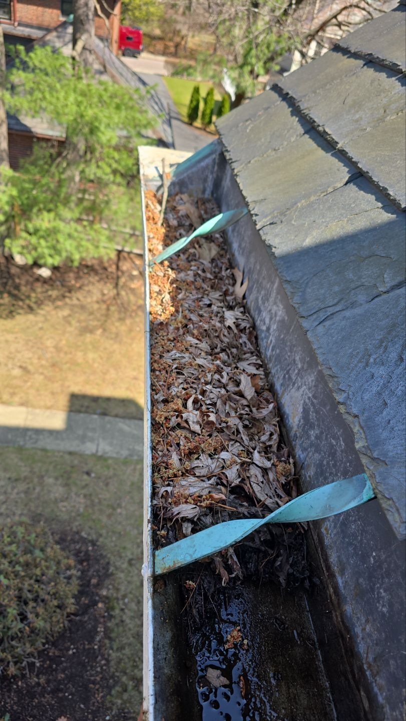 Commercial gutter cleaning Boston, MA before photo with filled gutters